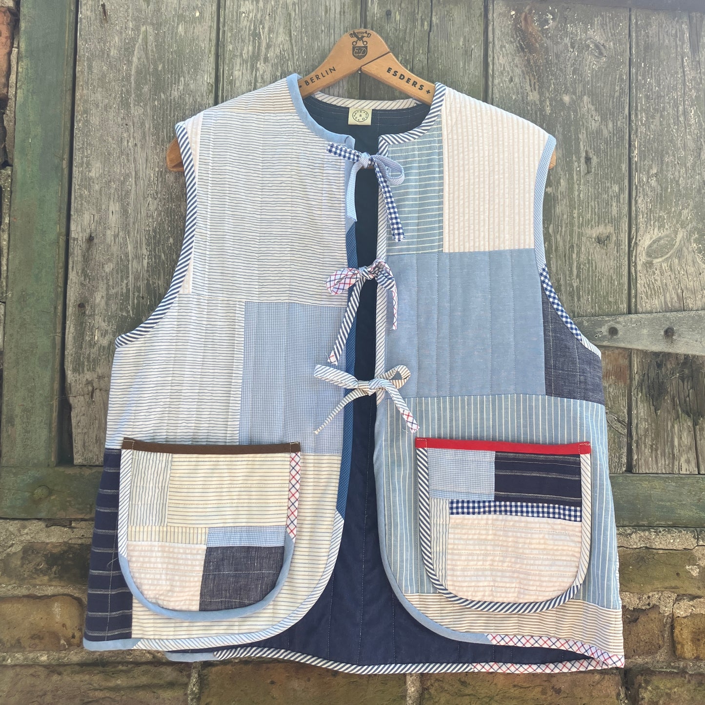 tie front quilted vest/waistcoat made from recycled men's cotton shirts in shades of blue