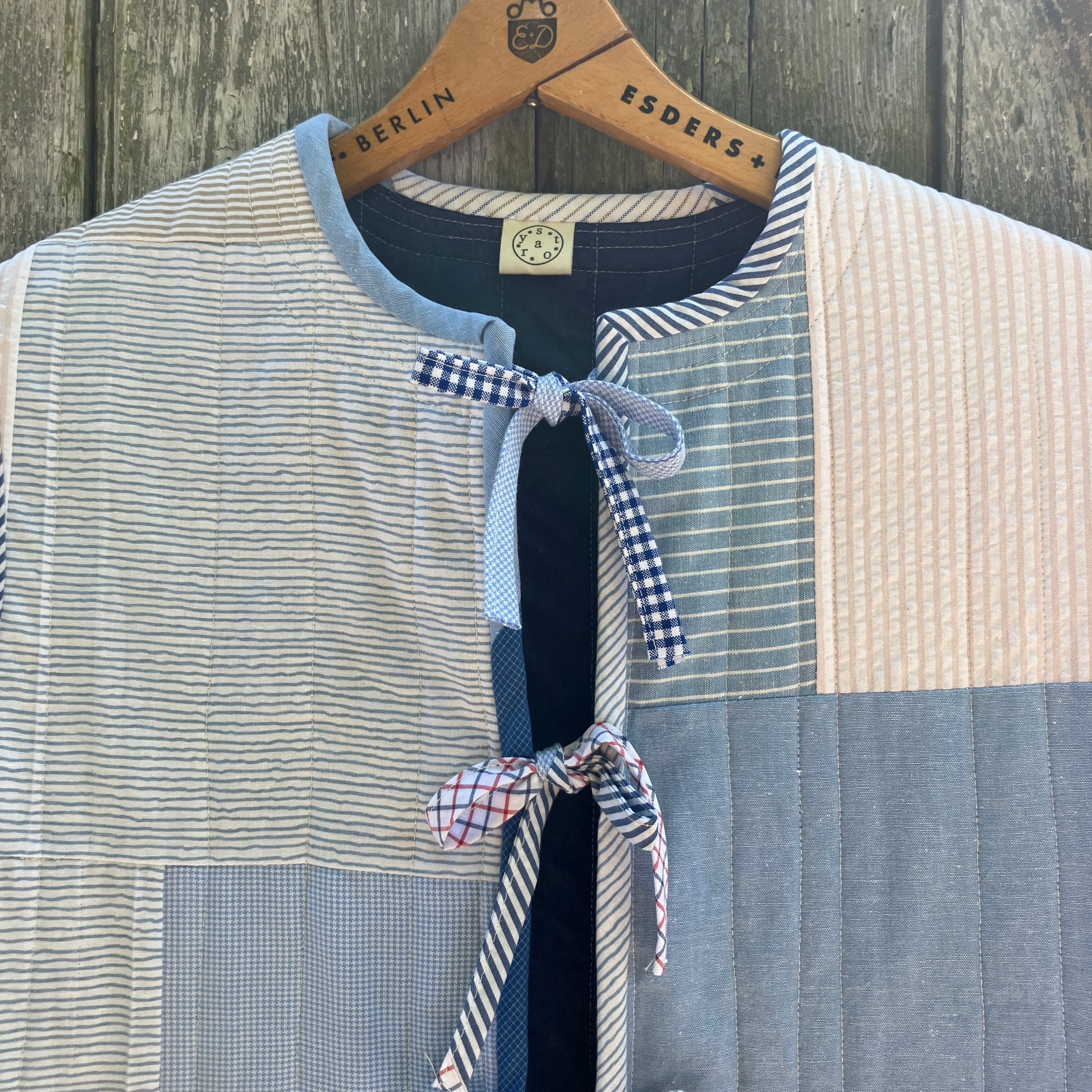 tie front quilted vest/waistcoat made from recycled men's cotton shirts in shades of blue