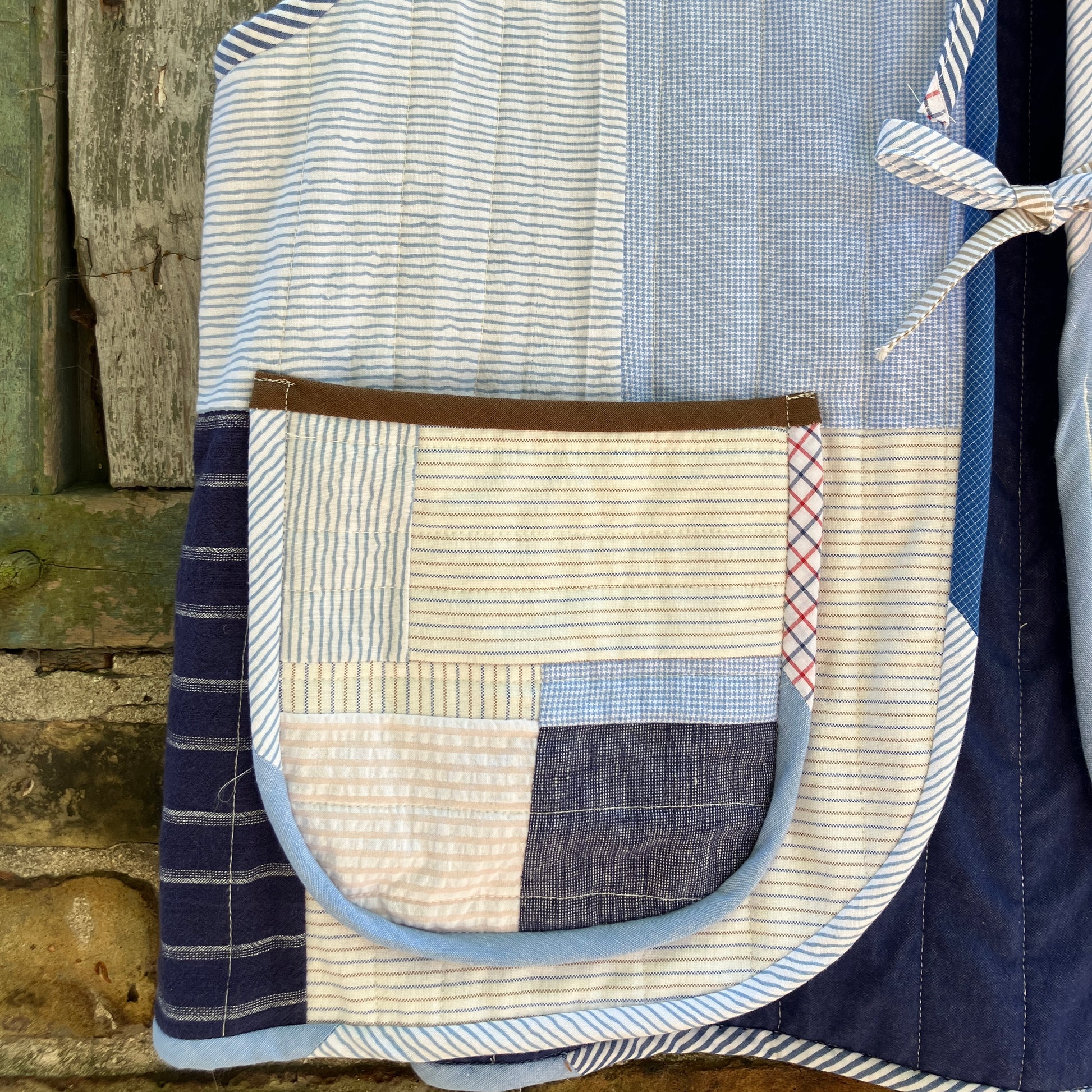 tie front quilted vest/waistcoat made from recycled men's cotton shirts in shades of blue