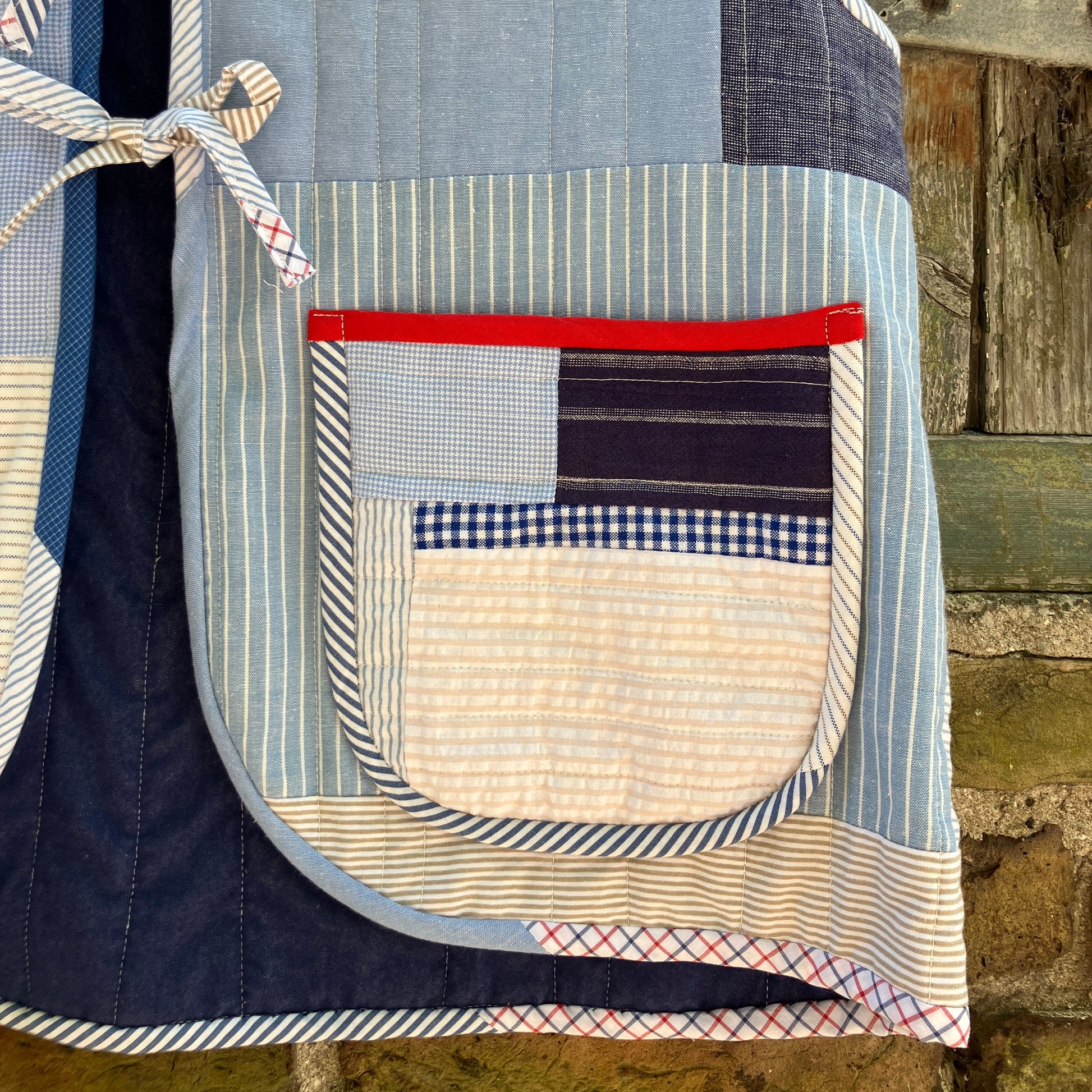tie front quilted vest/waistcoat made from recycled men's cotton shirts in shades of blue