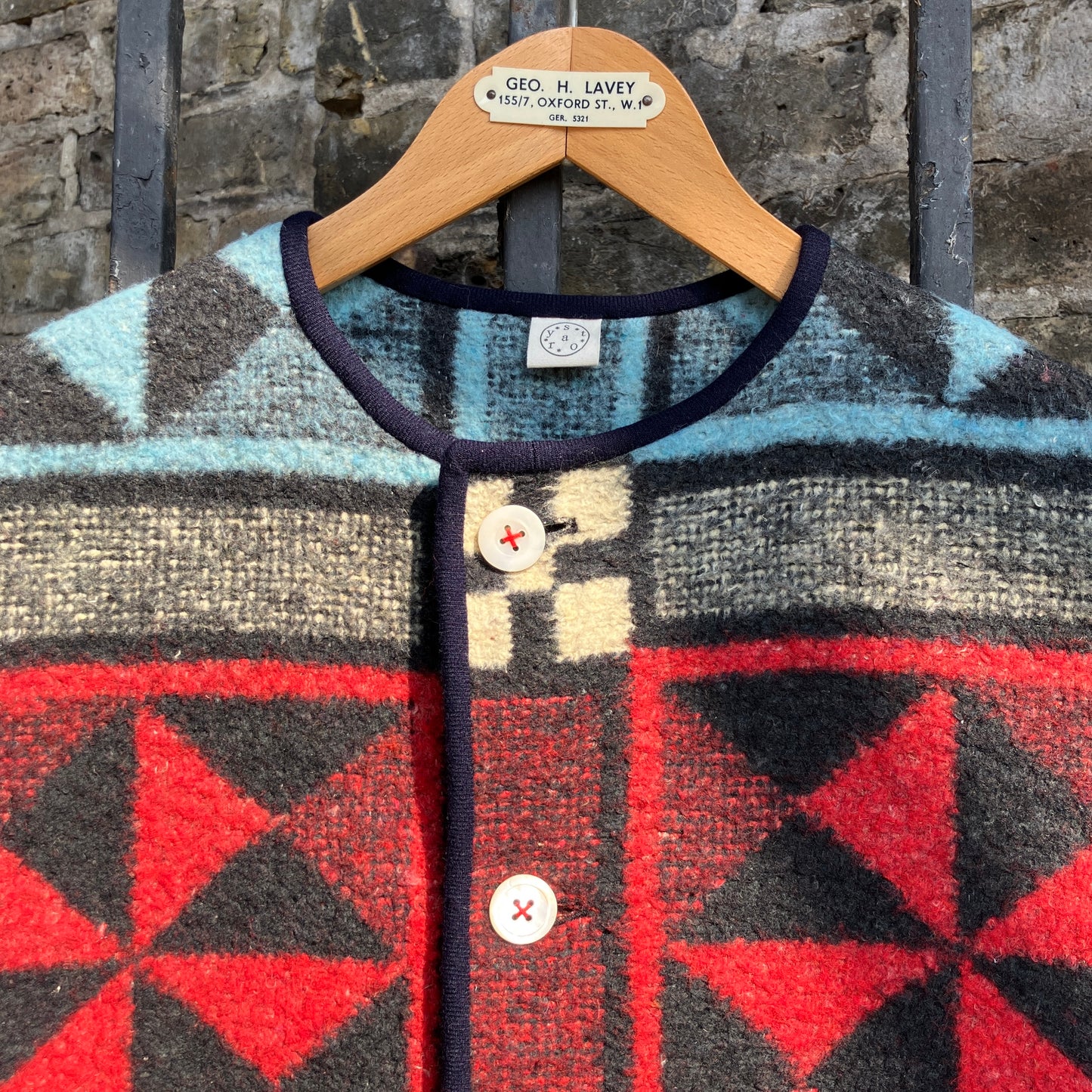 Cosy vest or waistcoat made from a reclaimed vintage patchwork-effect blanket.