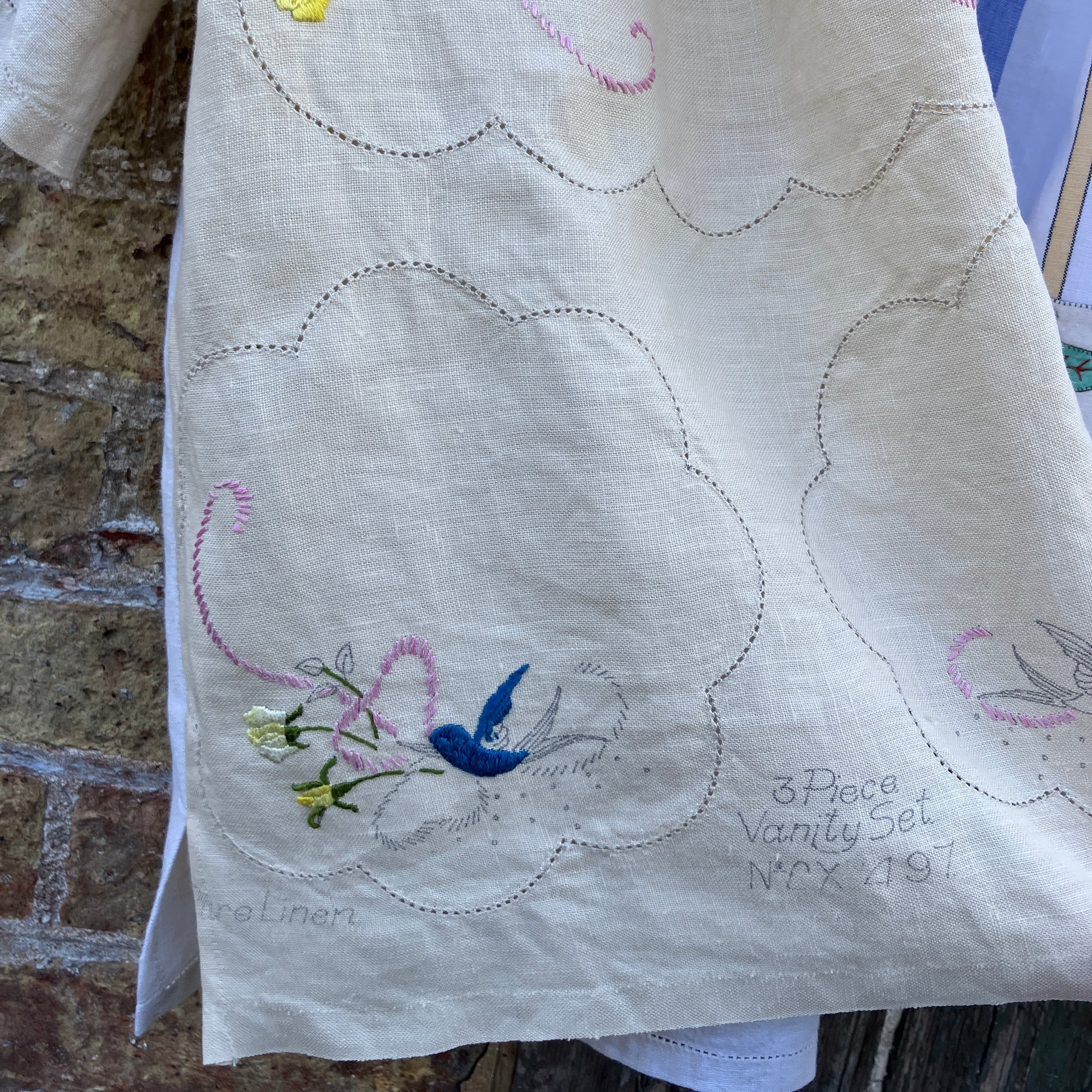 Patchwork shirt made from a selection of recycled embroidered vintage linen.