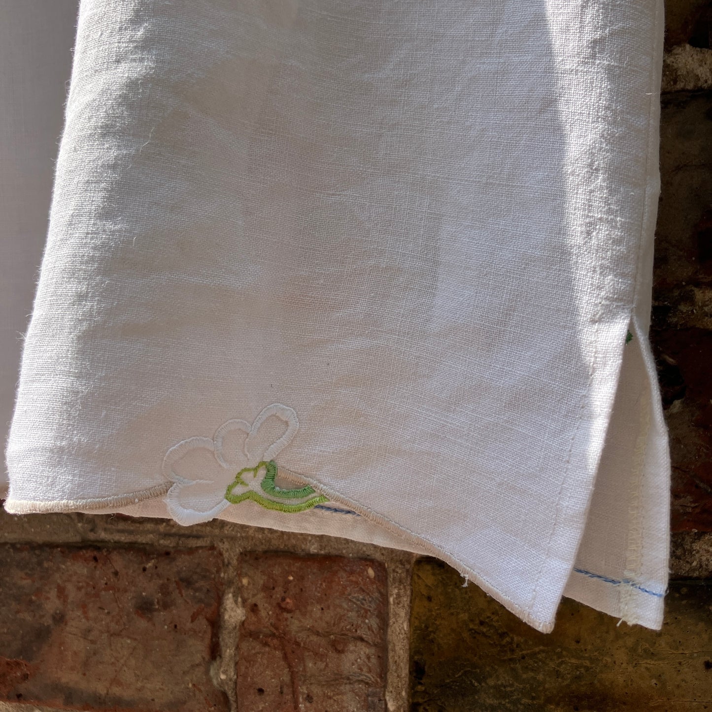 Swingy top made from found repurposed vintage tablecloths with embroidery and cutwork motifs.