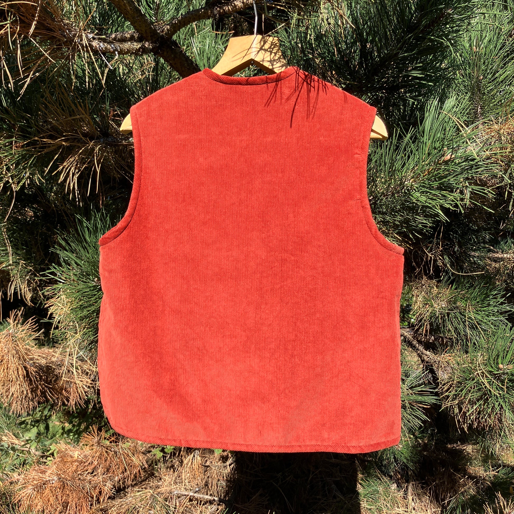 Cosy vest/waistcoat made from a secondhand remnant of rust-coloured corduroy, lined with found faux sheepskin fleece