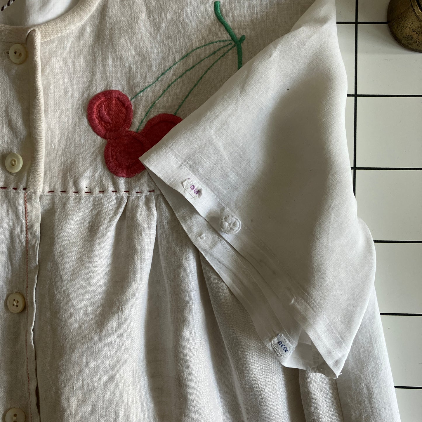 Top made from a patchwork of a recycled linen tablecloth with cherry motifs and antique bed linen