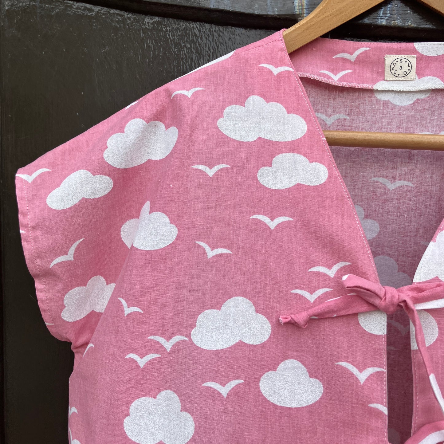 Boxy-fit tie-front top made from a repurposed vintage pink 1980s cloud-print curtain