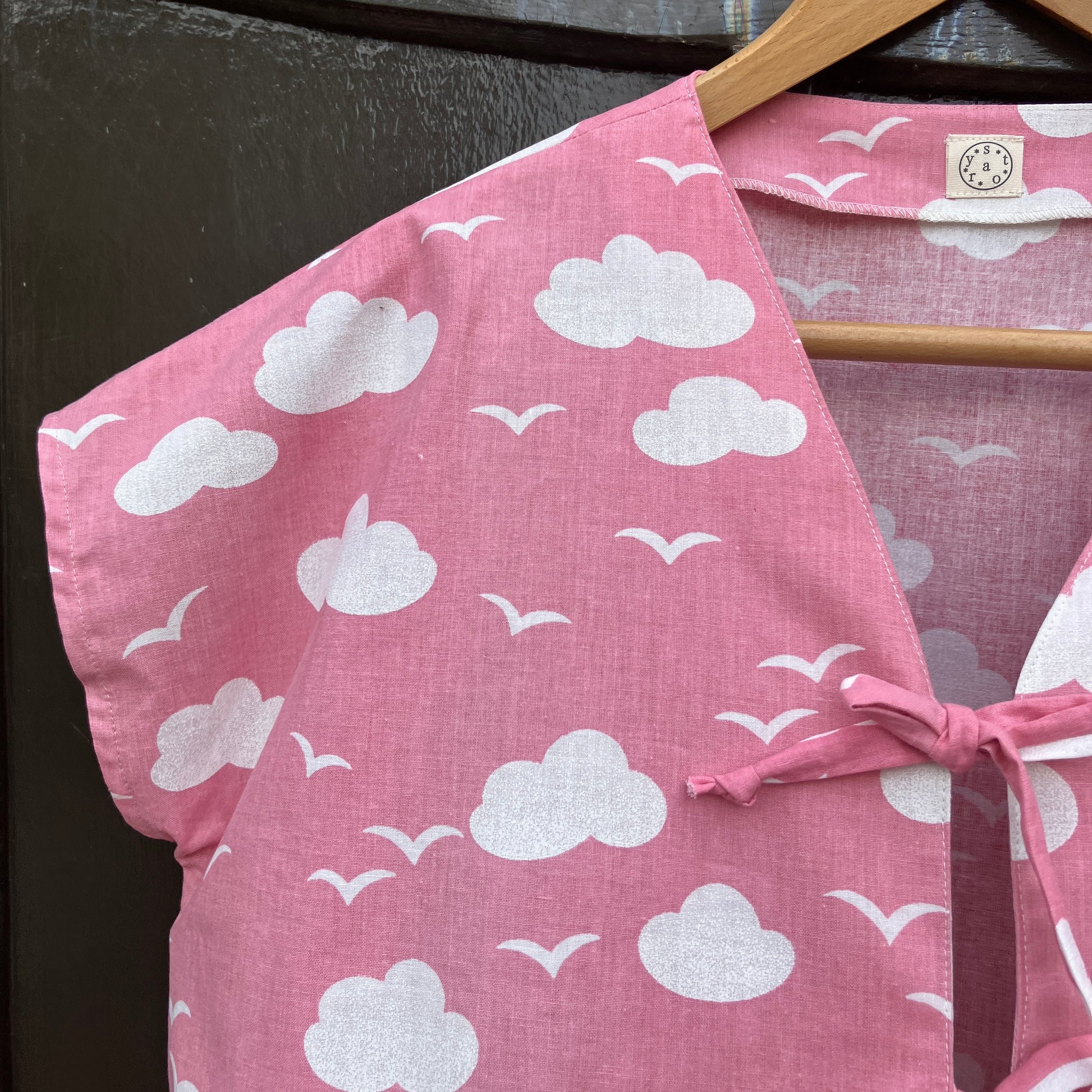 Boxy-fit tie-front top made from a repurposed vintage pink 1980s cloud-print curtain