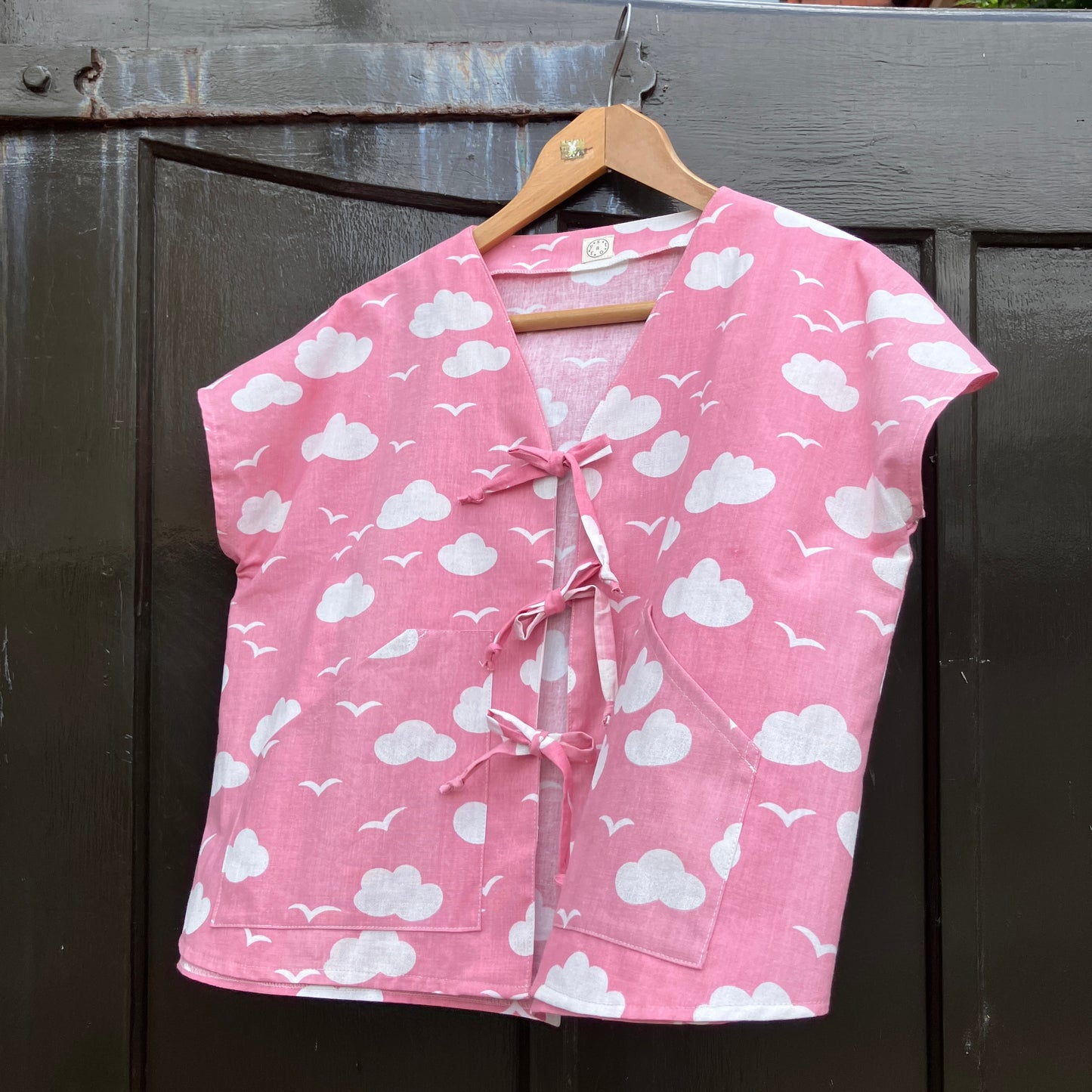 Boxy-fit tie-front top made from a repurposed vintage pink 1980s cloud-print curtain