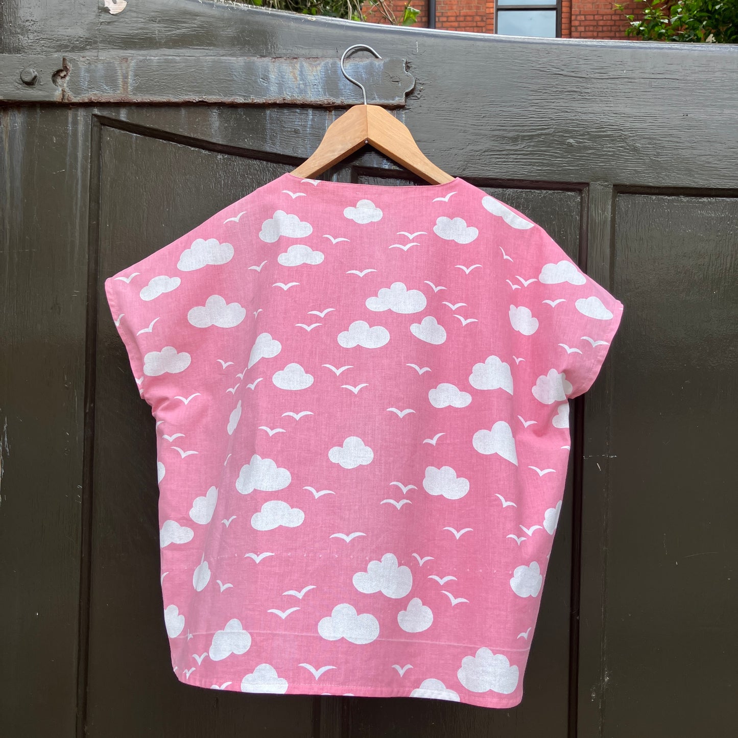 Boxy-fit tie-front top made from a repurposed vintage pink 1980s cloud-print curtain