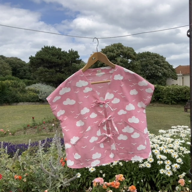 Boxy-fit tie-front top made from a repurposed vintage pink 1980s cloud-print curtain