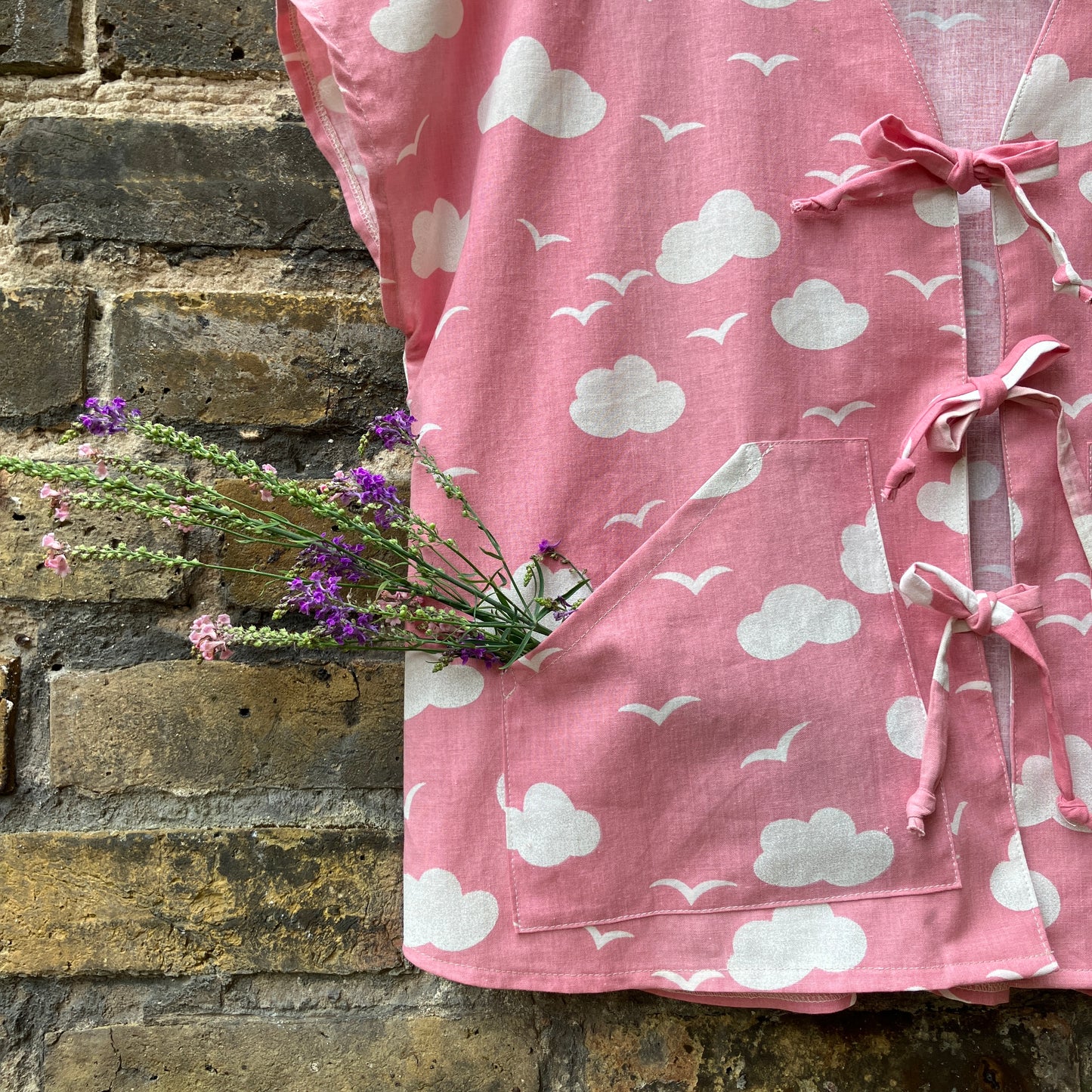 Boxy-fit tie-front top made from a repurposed vintage pink 1980s cloud-print curtain