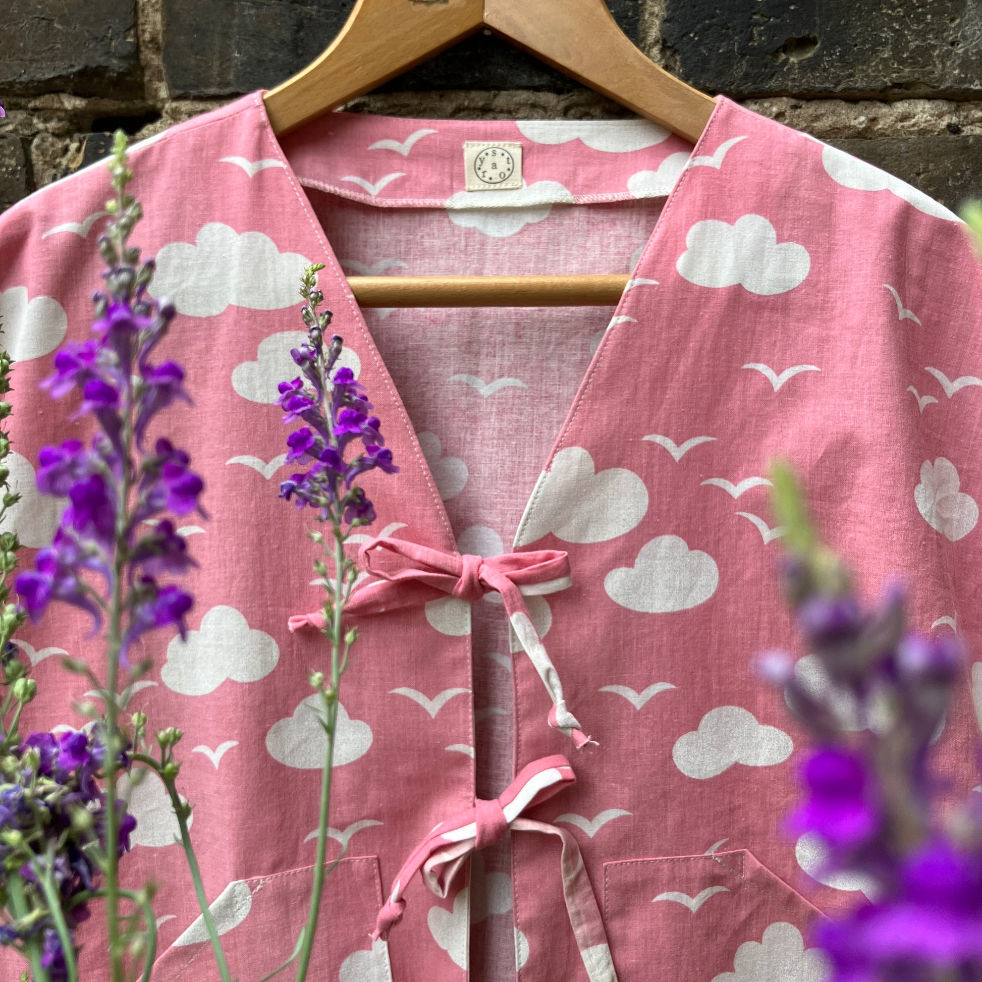 Boxy-fit tie-front top made from a repurposed vintage pink 1980s cloud-print curtain