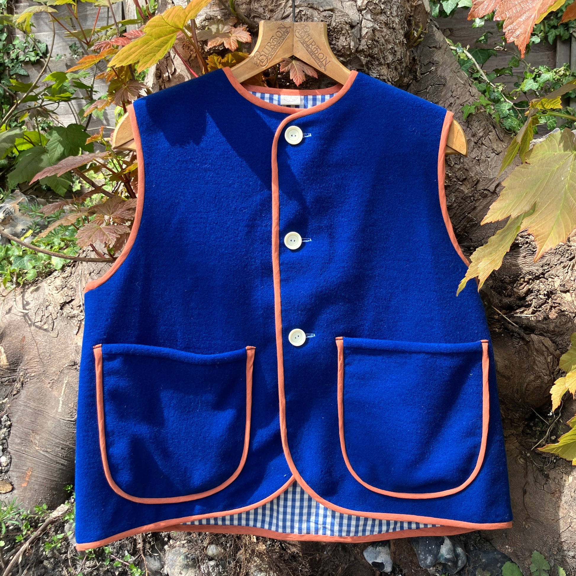 Vest made from a piece of  soft cobalt blue wool, lined with cotton gingham