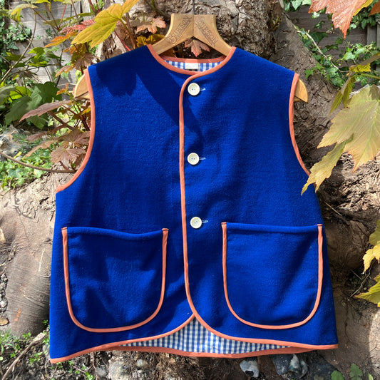 Vest made from a piece of  soft cobalt blue wool, lined with cotton gingham