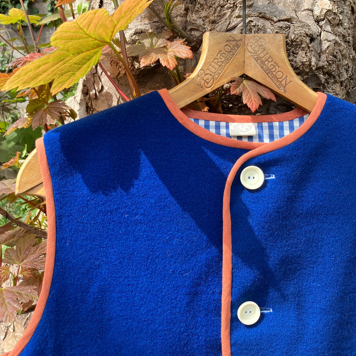 Vest made from a piece of soft cobalt blue wool, lined with cotton gingham