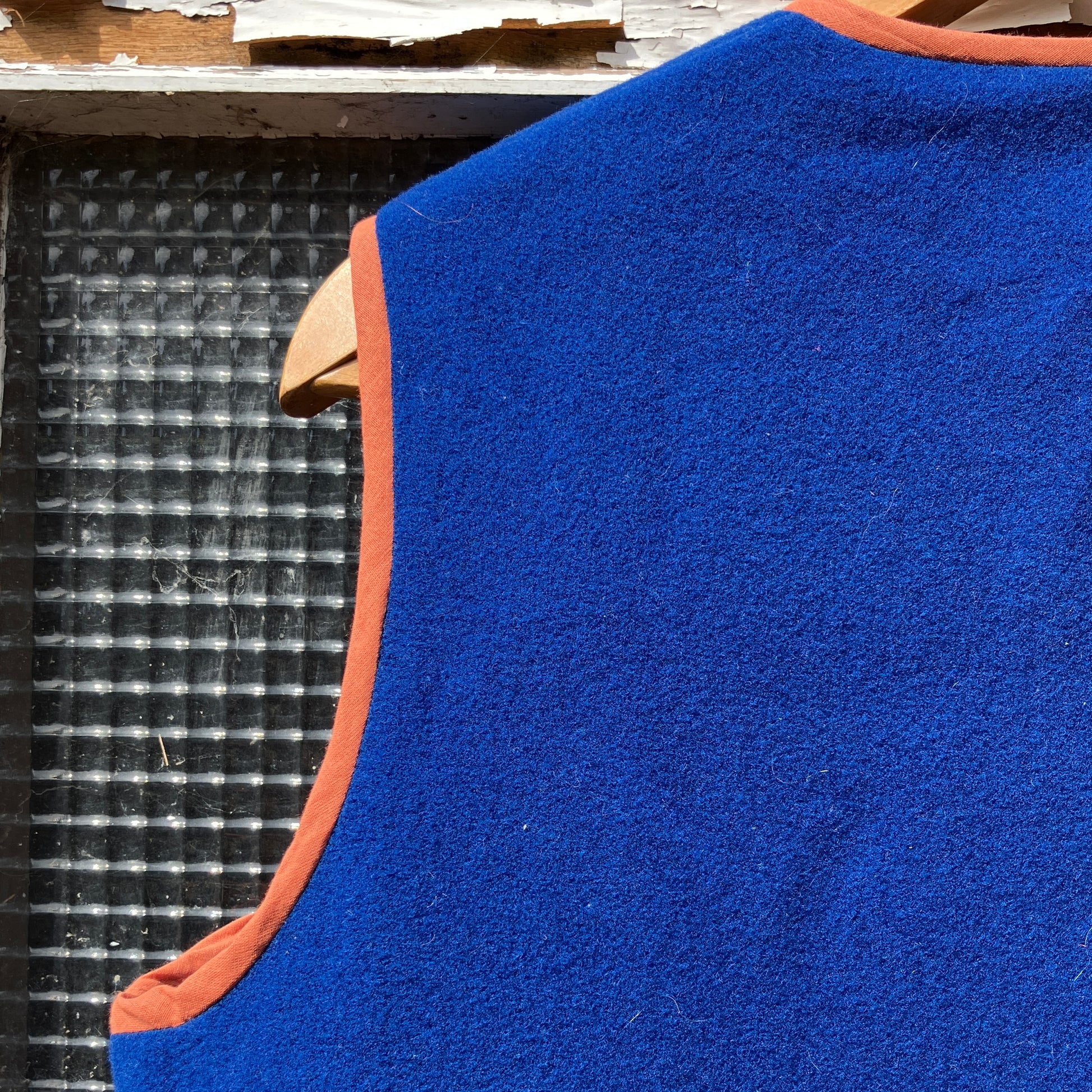 Vest made from a piece of  soft cobalt blue wool, lined with cotton gingham