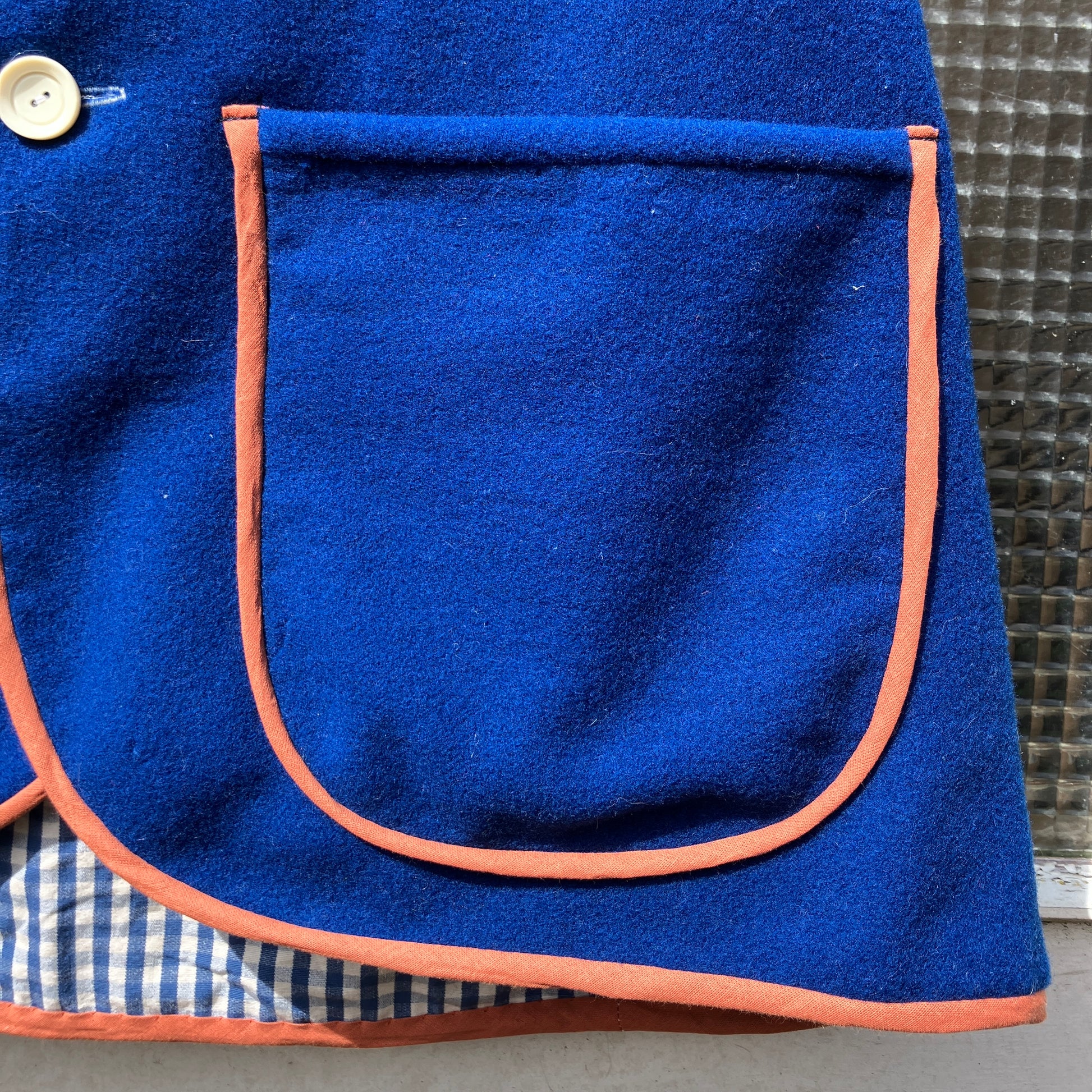 Vest made from a piece of  soft cobalt blue wool, lined with cotton gingham