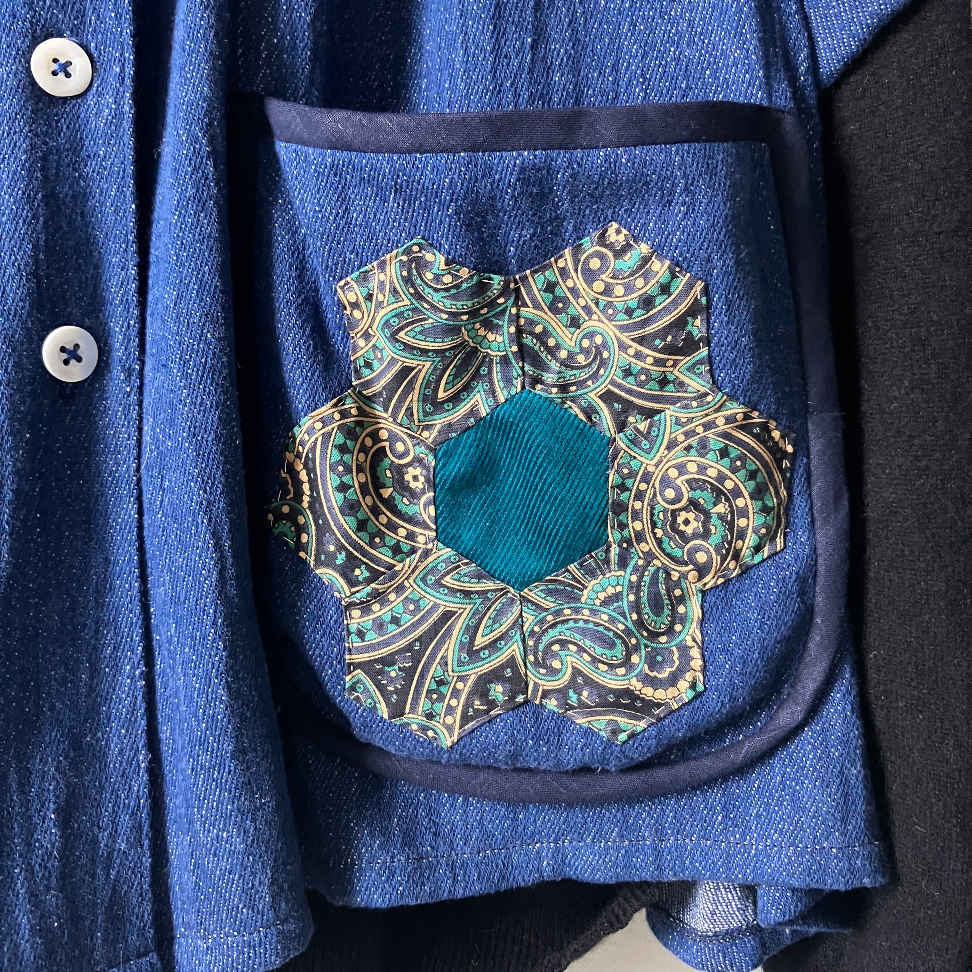 Smock top hand made from deadstock denim with thrifted patchwork hexagons on the pockets