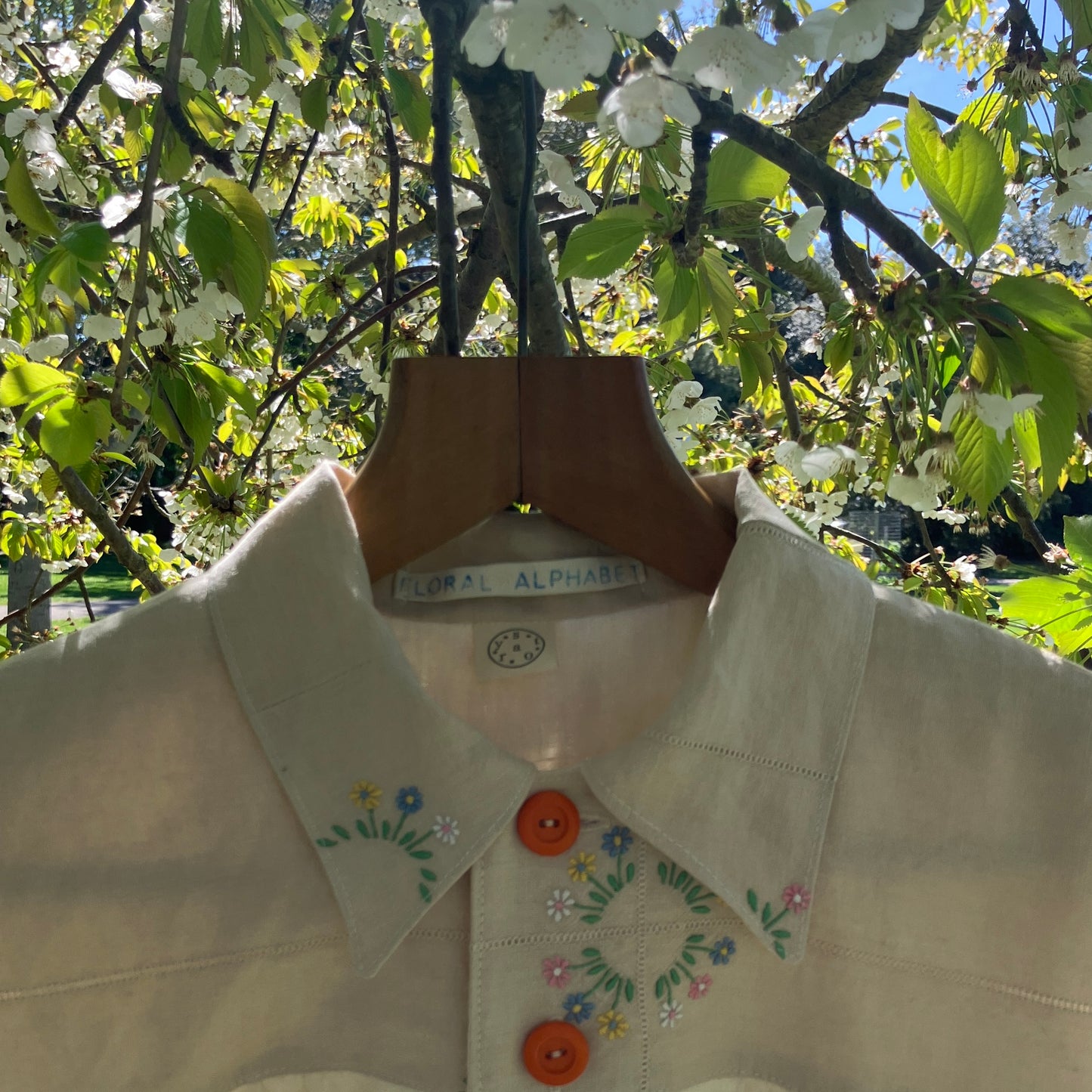 shirt made from vintage cross stitch flowers recycled linen panel