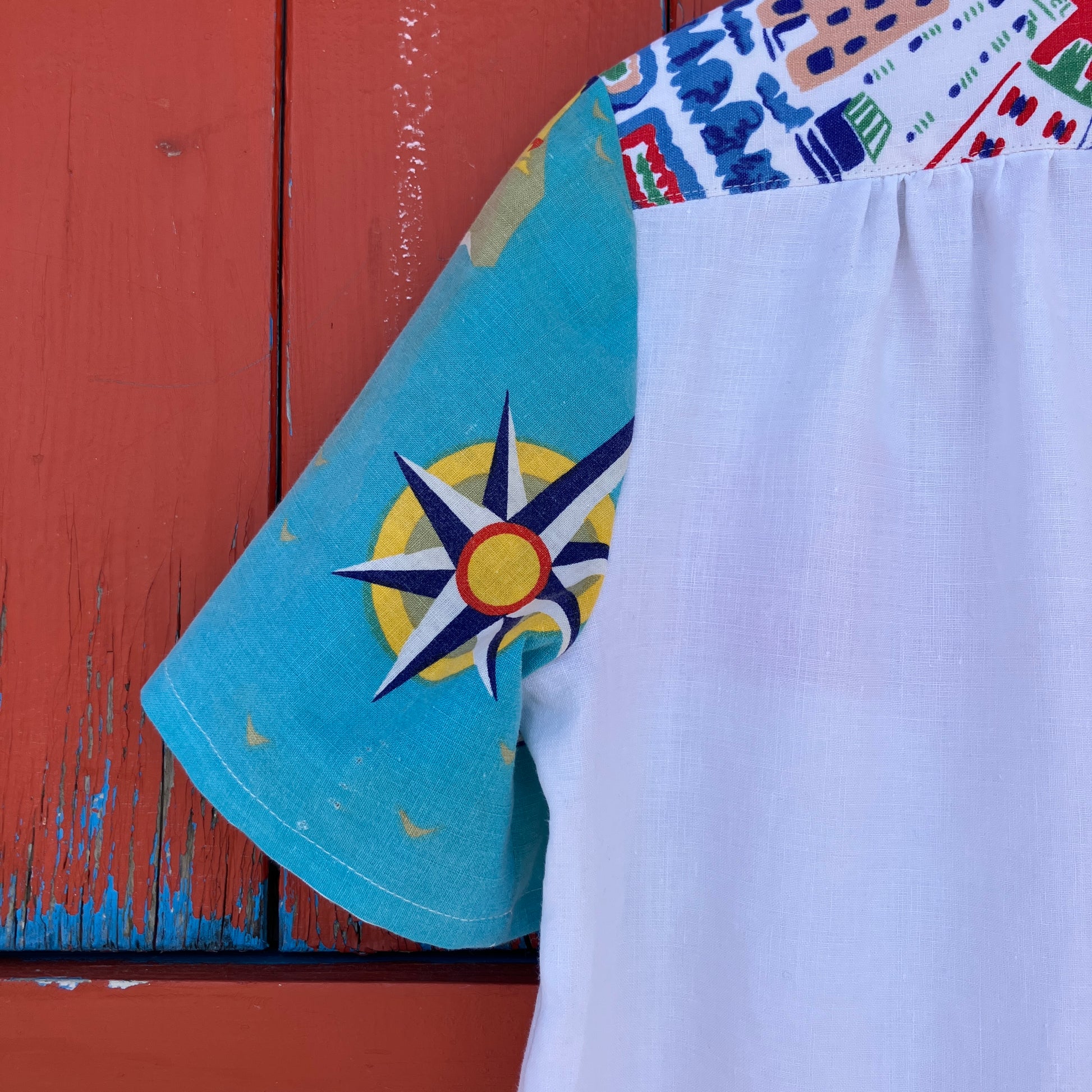 Holiday shirt made from an upcycled beach scenes linen tablecloth