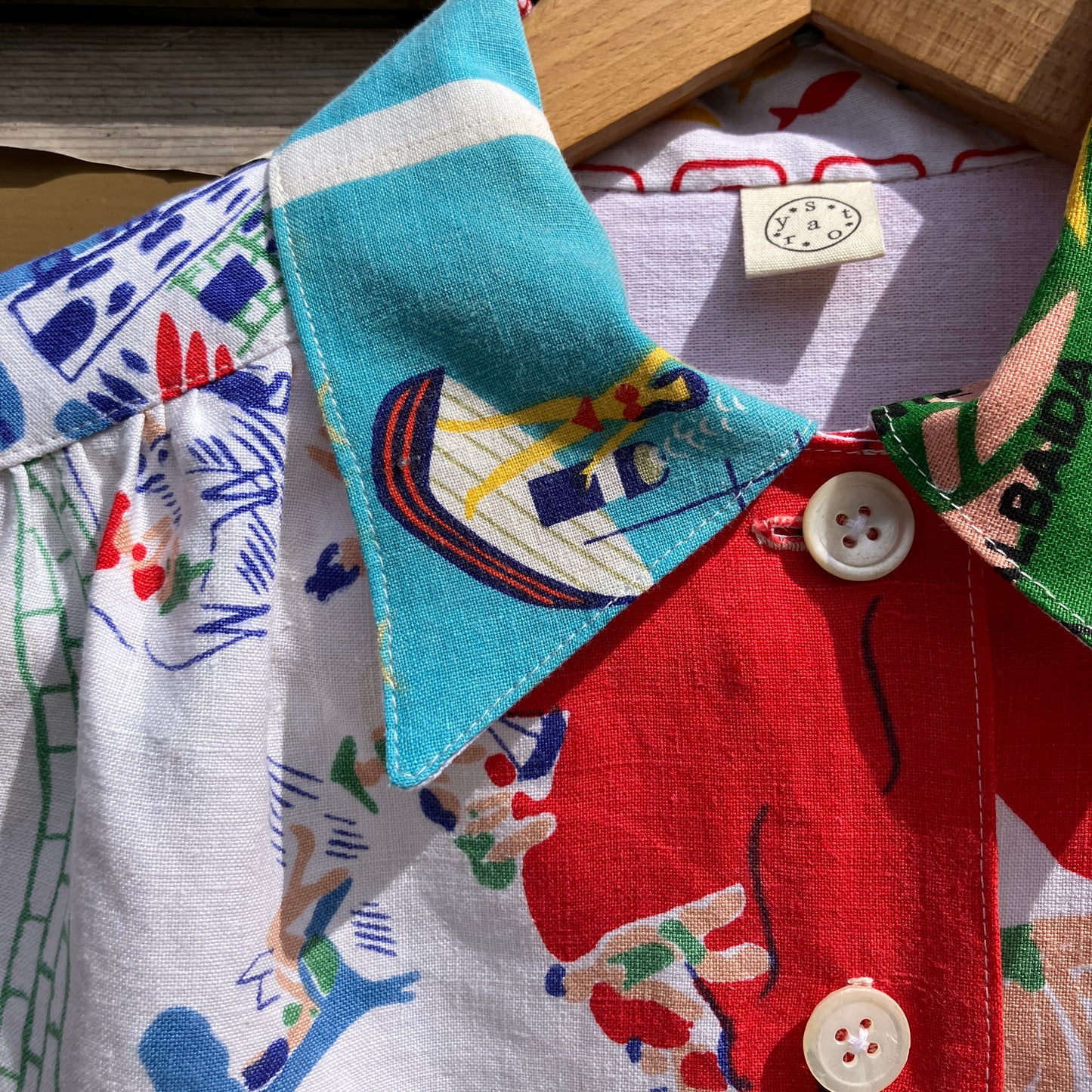 Holiday shirt made from an upcycled beach scenes linen tablecloth