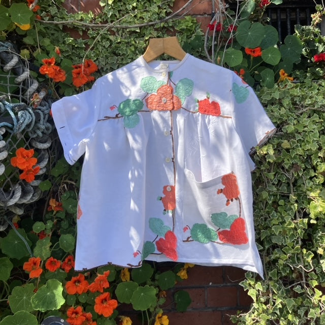 summer top hand made from a reclaimed tablecloth with appliqué nasturtiums in red, orange, peach and green