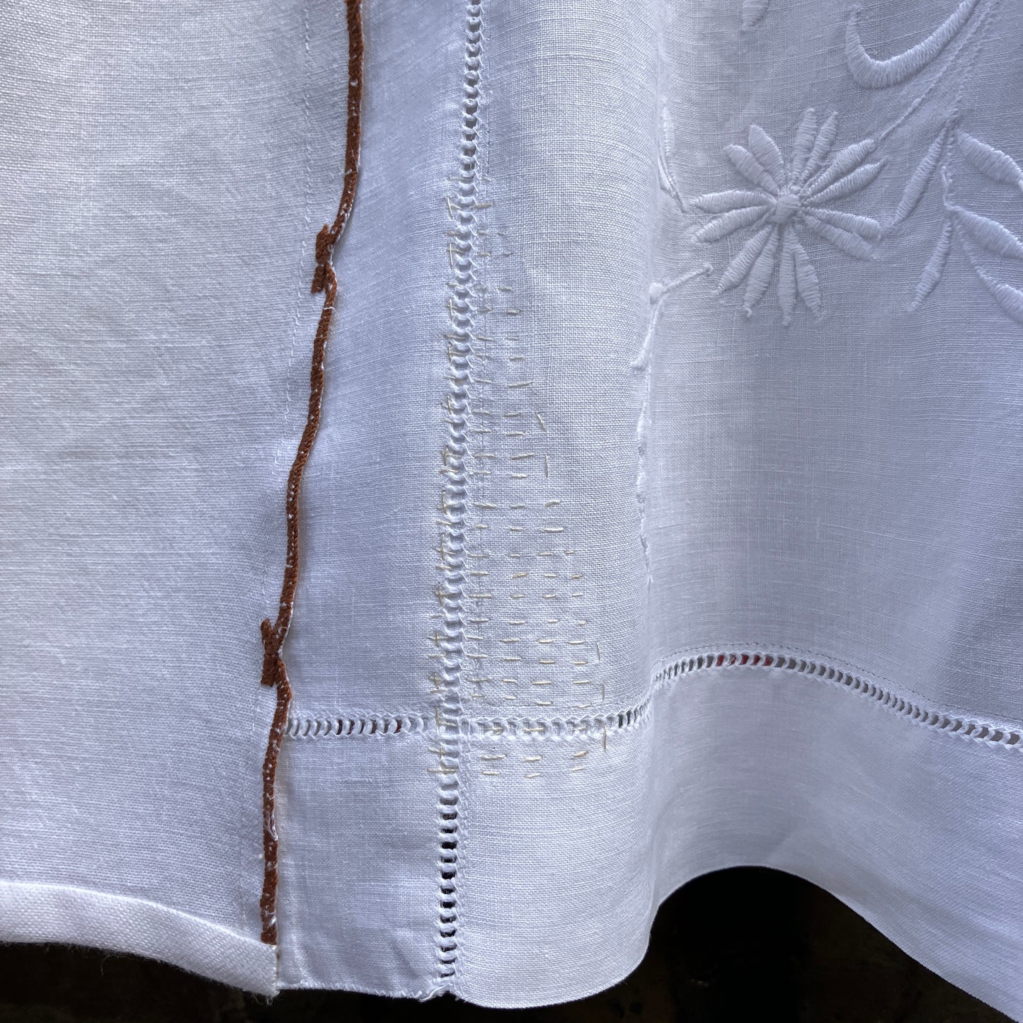 summer top hand made from a reclaimed tablecloth with appliqué nasturtiums in red, orange, peach and green (close-up of visible mend)