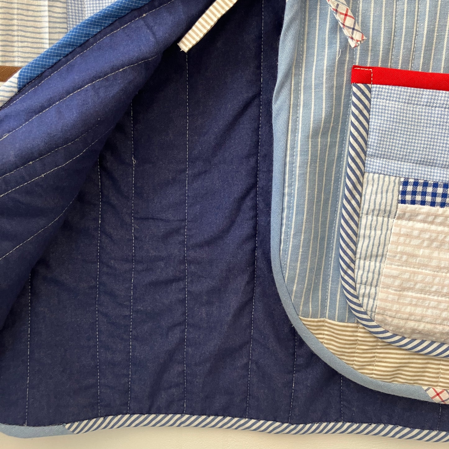tie front quilted vest/waistcoat made from recycled men's cotton shirts in shades of blue