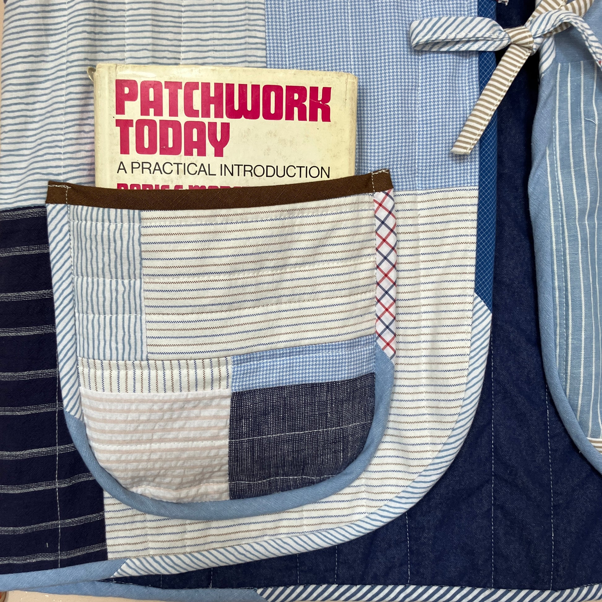 tie front quilted vest/waistcoat made from recycled men's cotton shirts in shades of blue