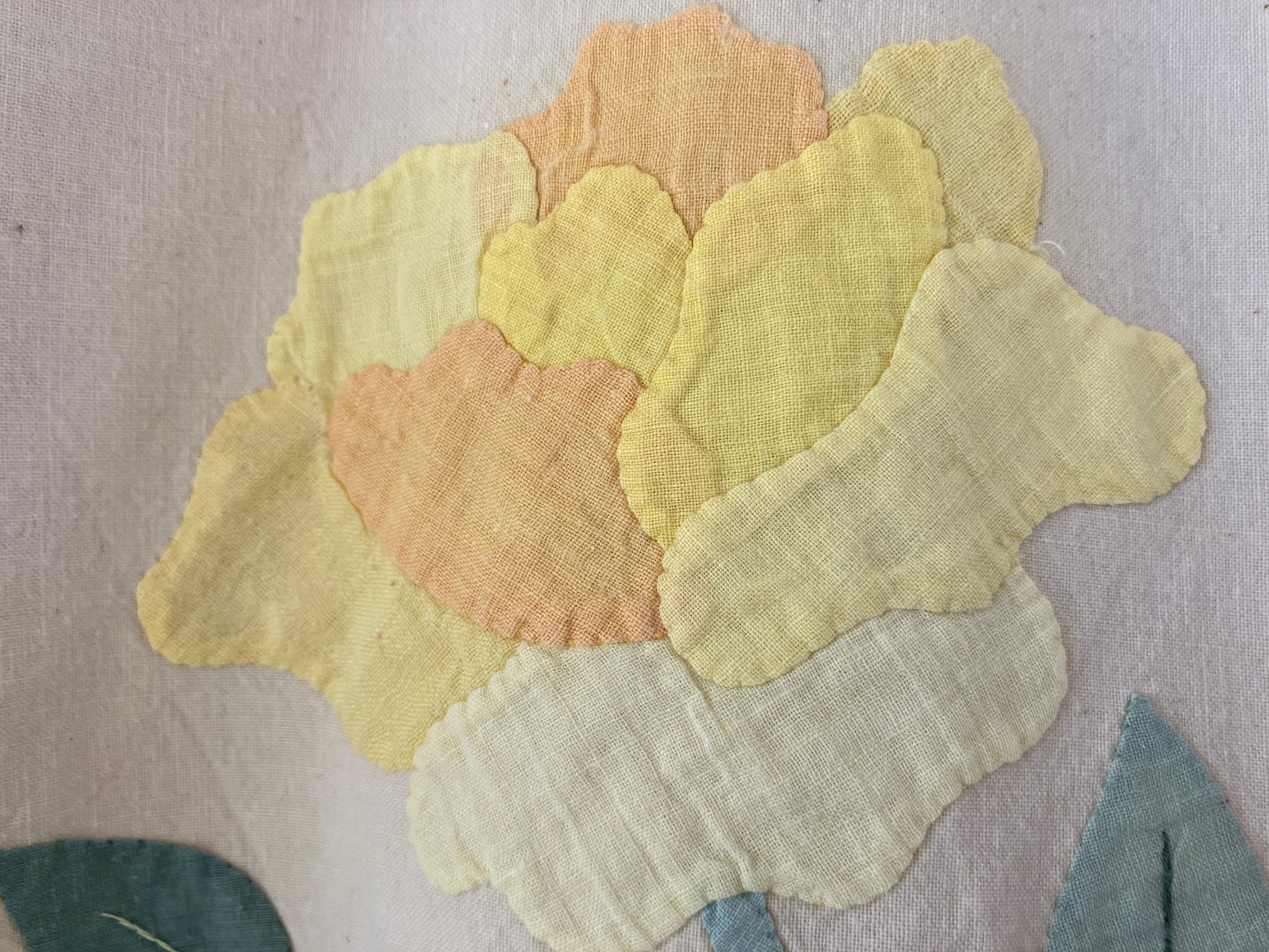 Pretty boxy top with pastel-coloured floral appliqué, made from a vintage cotton bedspread with scalloped edges