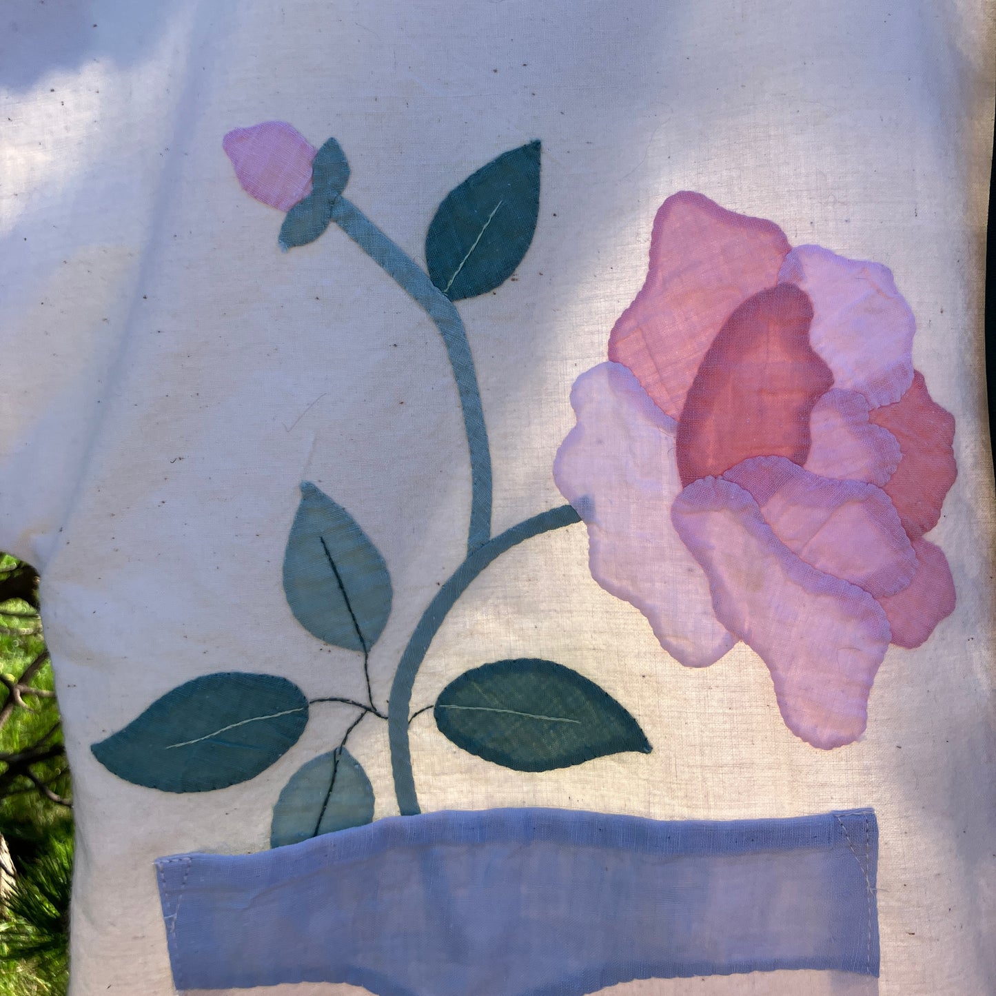 Pretty boxy top with pastel-coloured floral appliqué, made from a vintage cotton bedspread with scalloped edges