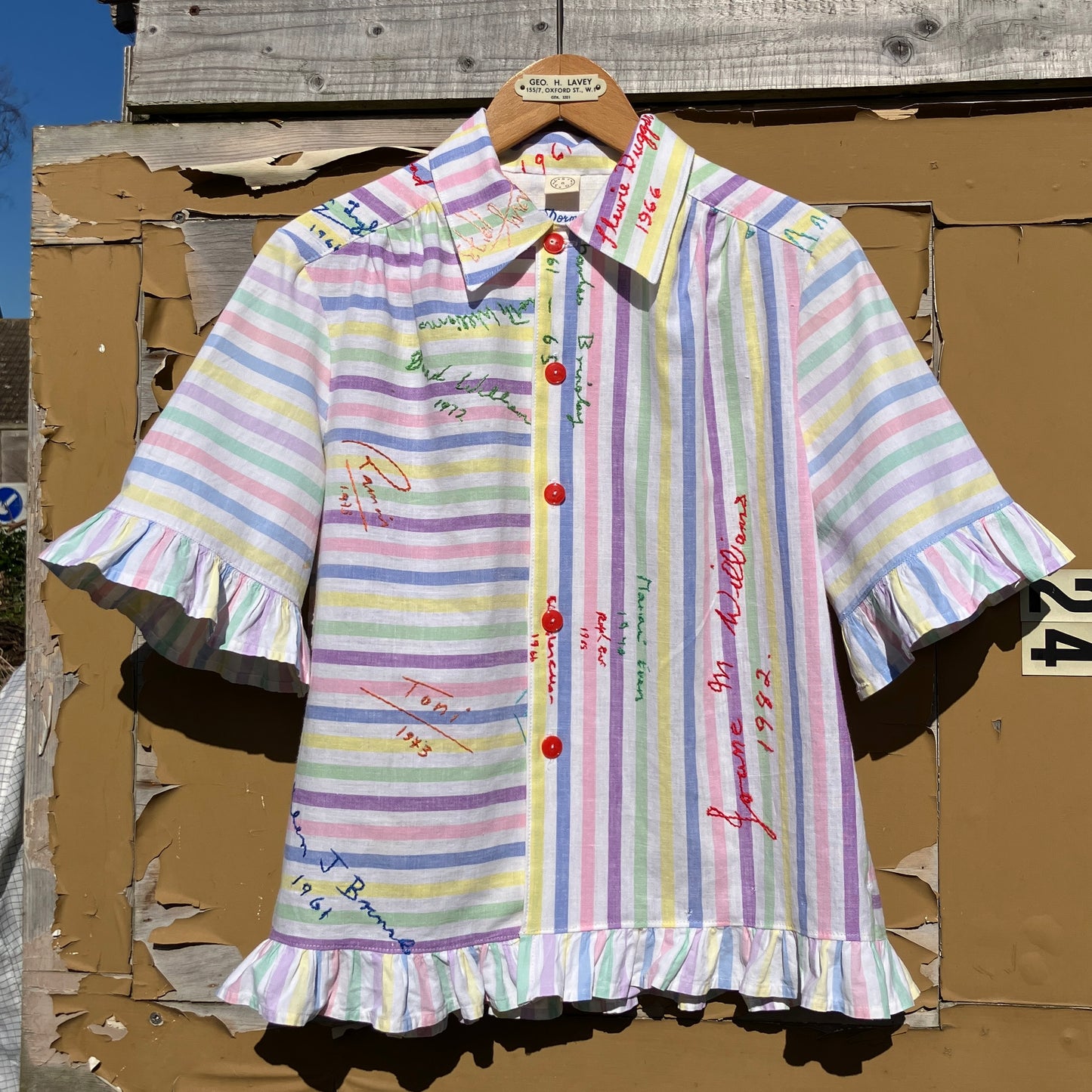 Totally unique ruffle shirt made from a soft cotton reclaimed vintage candy stripe bedsheet adorned with embroidered signatures!