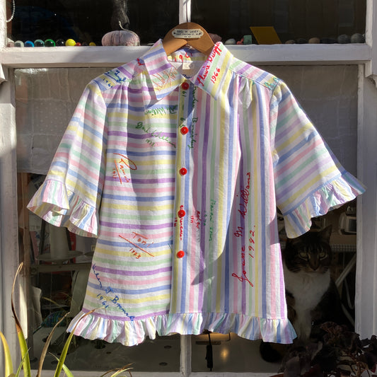 Totally unique ruffle shirt made from a soft cotton reclaimed vintage candy stripe bedsheet adorned with embroidered signatures!