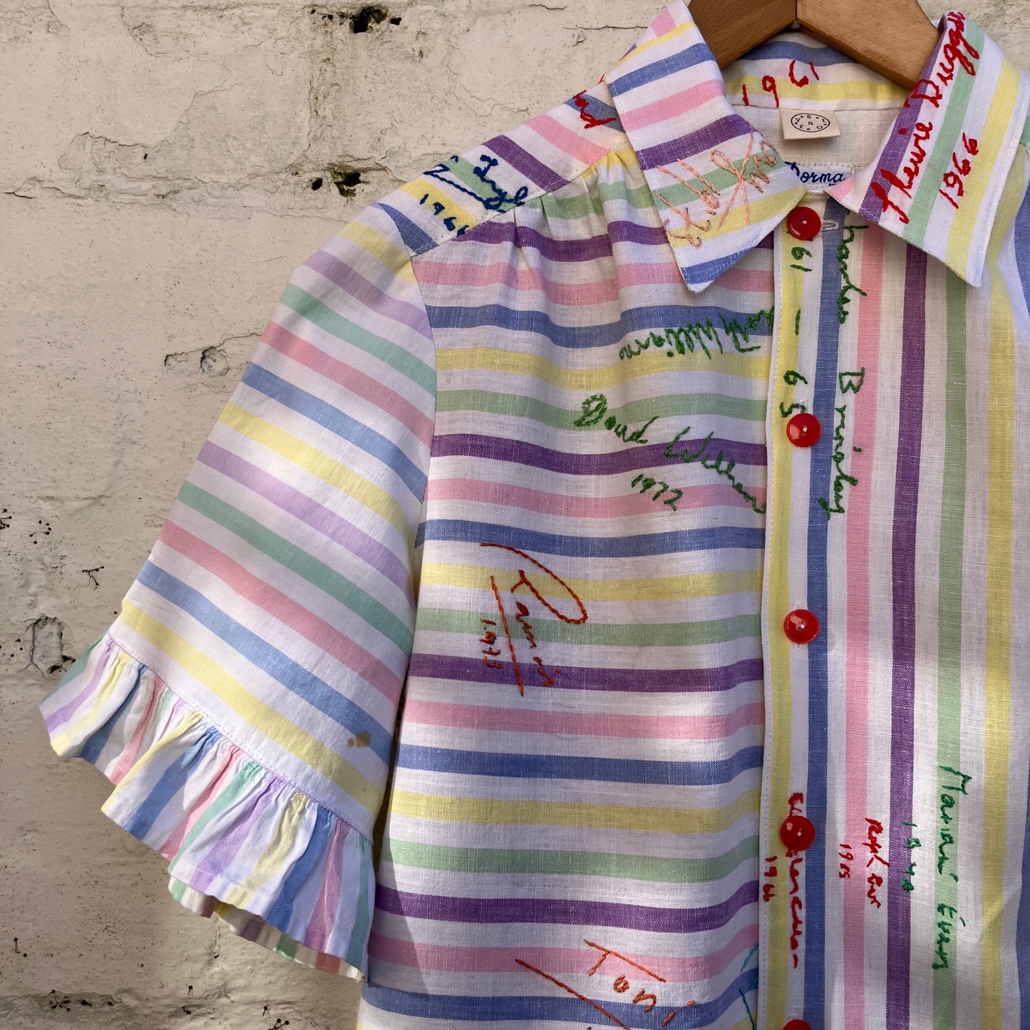 Totally unique ruffle shirt made from a soft cotton reclaimed vintage candy stripe bedsheet adorned with embroidered signatures!