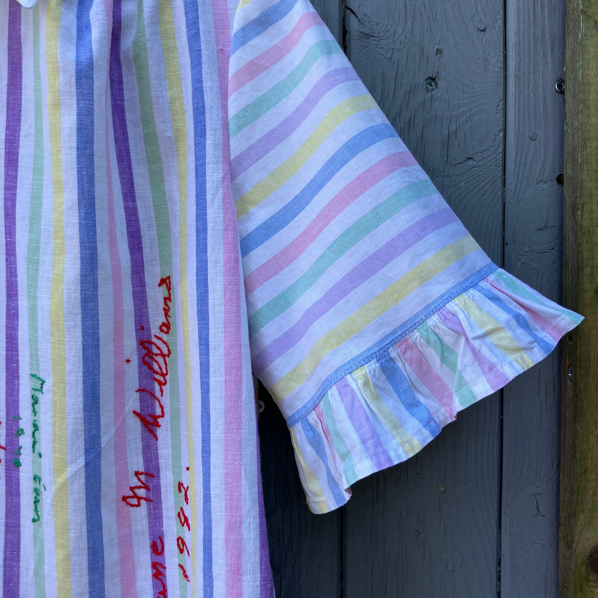 Totally unique ruffle shirt made from a soft cotton reclaimed vintage candy stripe bedsheet adorned with embroidered signatures!