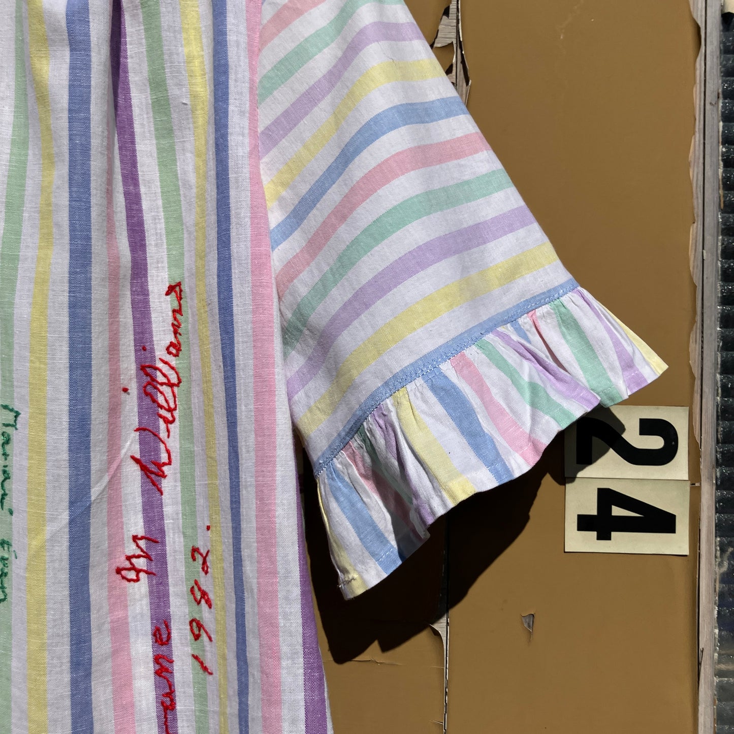 Totally unique ruffle shirt made from a soft cotton reclaimed vintage candy stripe bedsheet adorned with embroidered signatures!