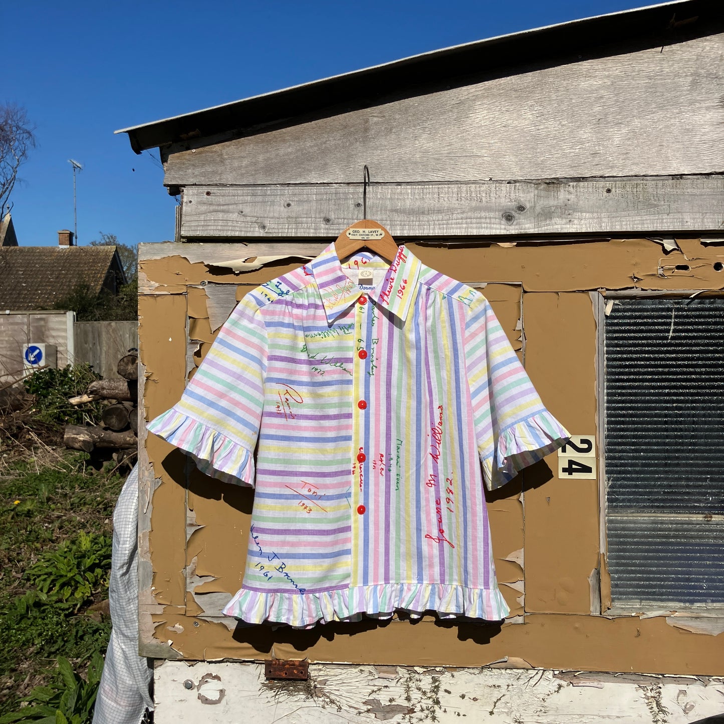 Totally unique ruffle shirt made from a soft cotton reclaimed vintage candy stripe bedsheet adorned with embroidered signatures!