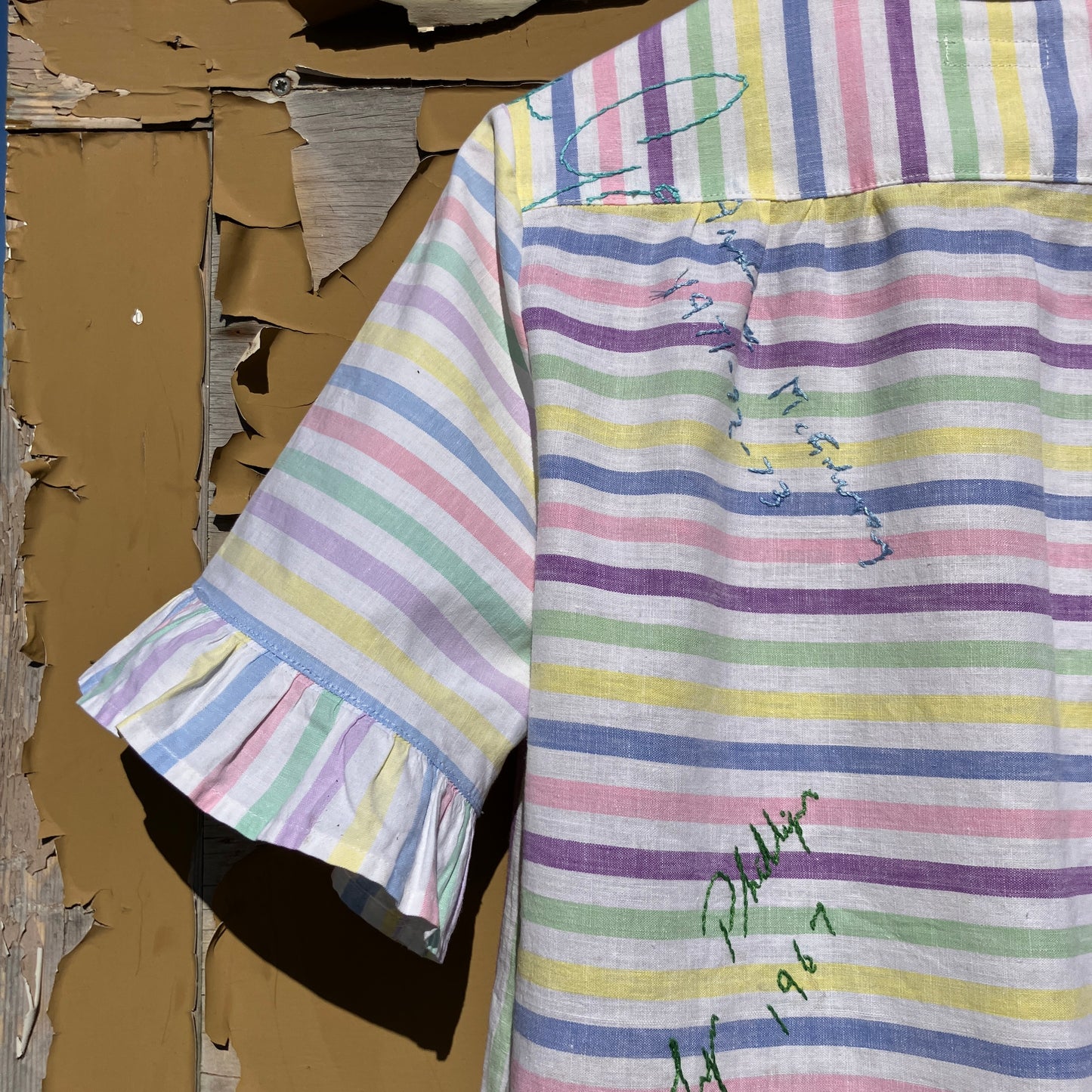 Totally unique ruffle shirt made from a soft cotton reclaimed vintage candy stripe bedsheet adorned with embroidered signatures!