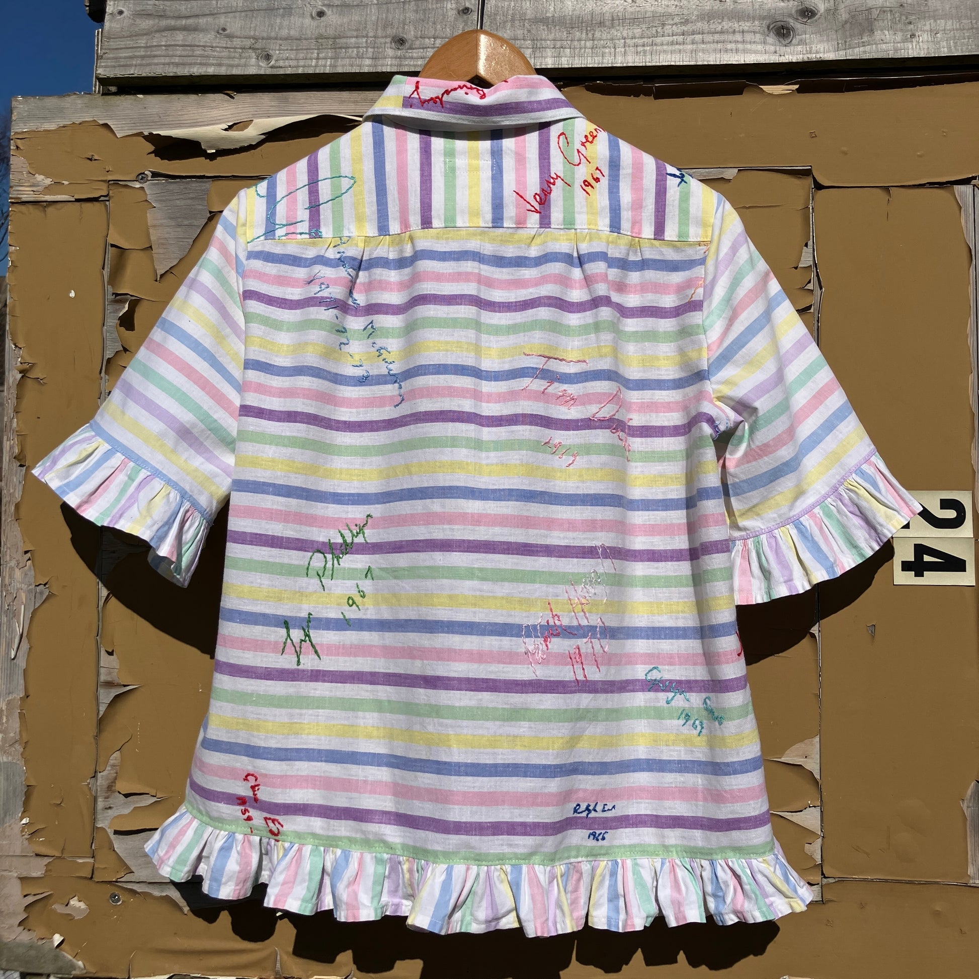 Totally unique ruffle shirt made from a soft cotton reclaimed vintage candy stripe bedsheet adorned with embroidered signatures!