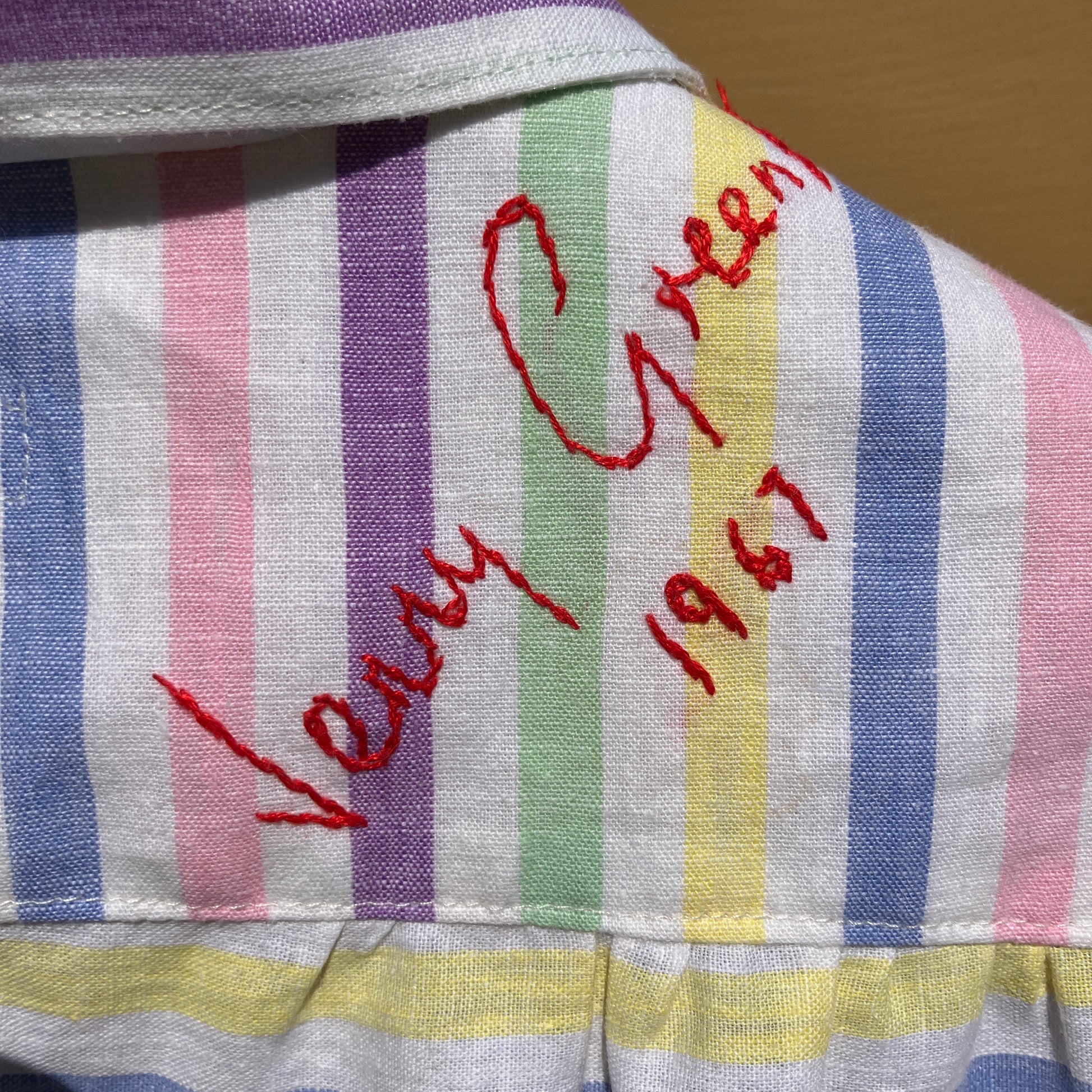 Totally unique ruffle shirt made from a soft cotton reclaimed vintage candy stripe bedsheet adorned with embroidered signatures!