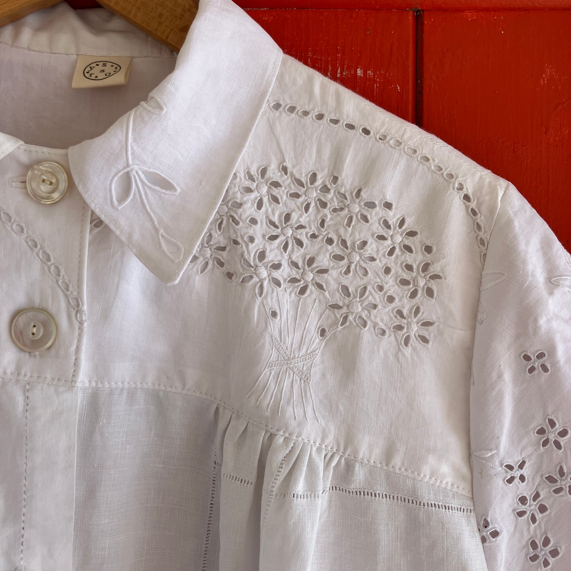pretty, breezy blouse made from a 
patchwork of reclaimed vintage cotton and linen white cutwork tablecloths.