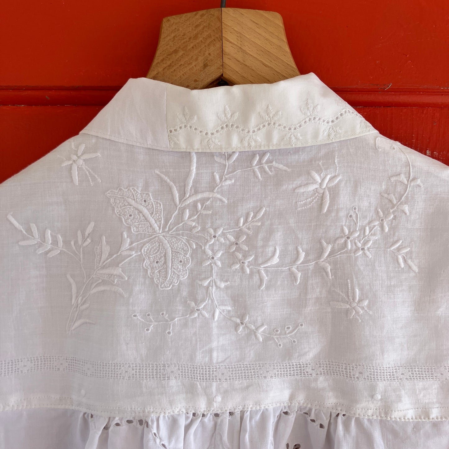 pretty, breezy blouse made from a
patchwork of reclaimed vintage cotton and linen white cutwork tablecloths.