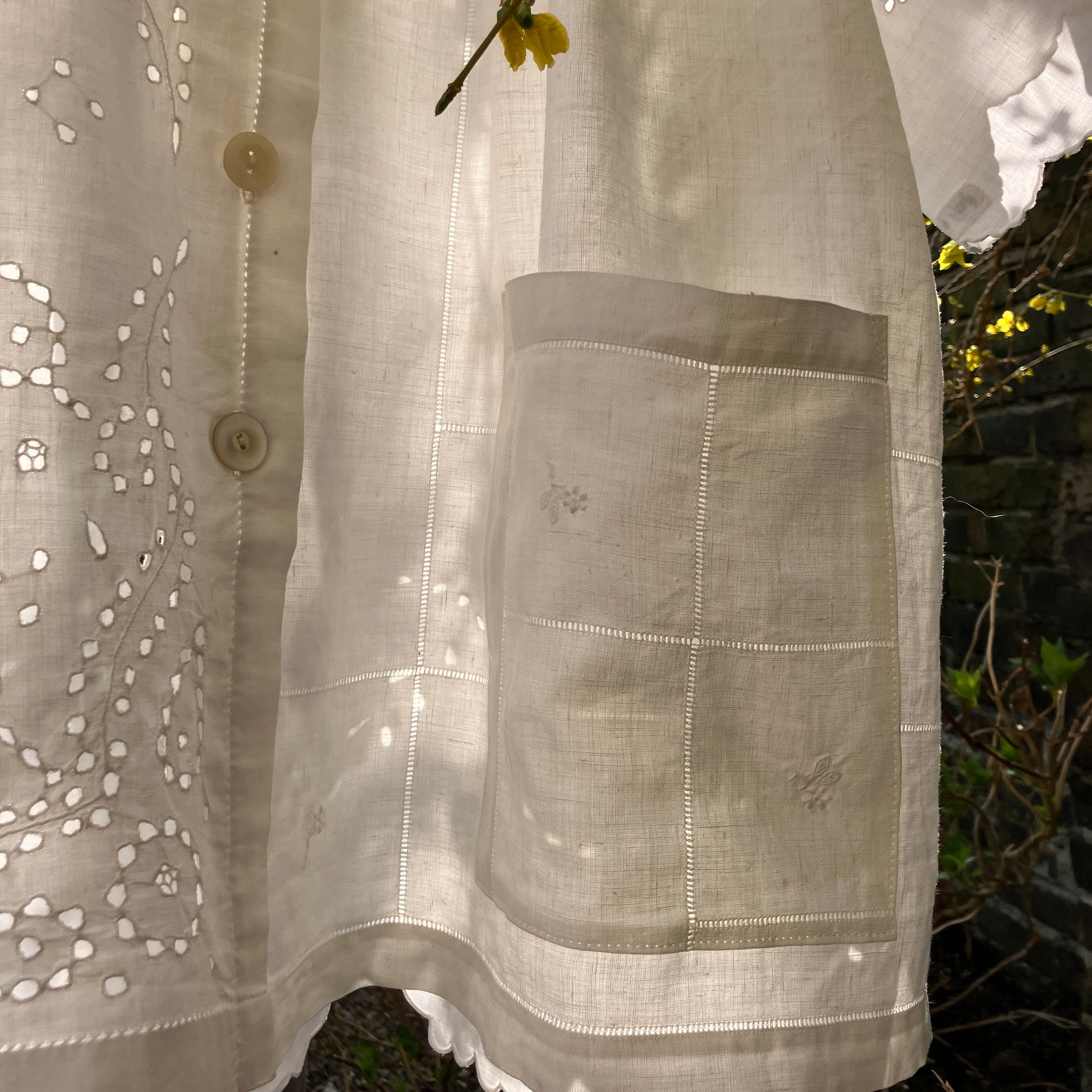 pretty, breezy blouse made from a 
patchwork of reclaimed vintage cotton and linen white cutwork tablecloths.