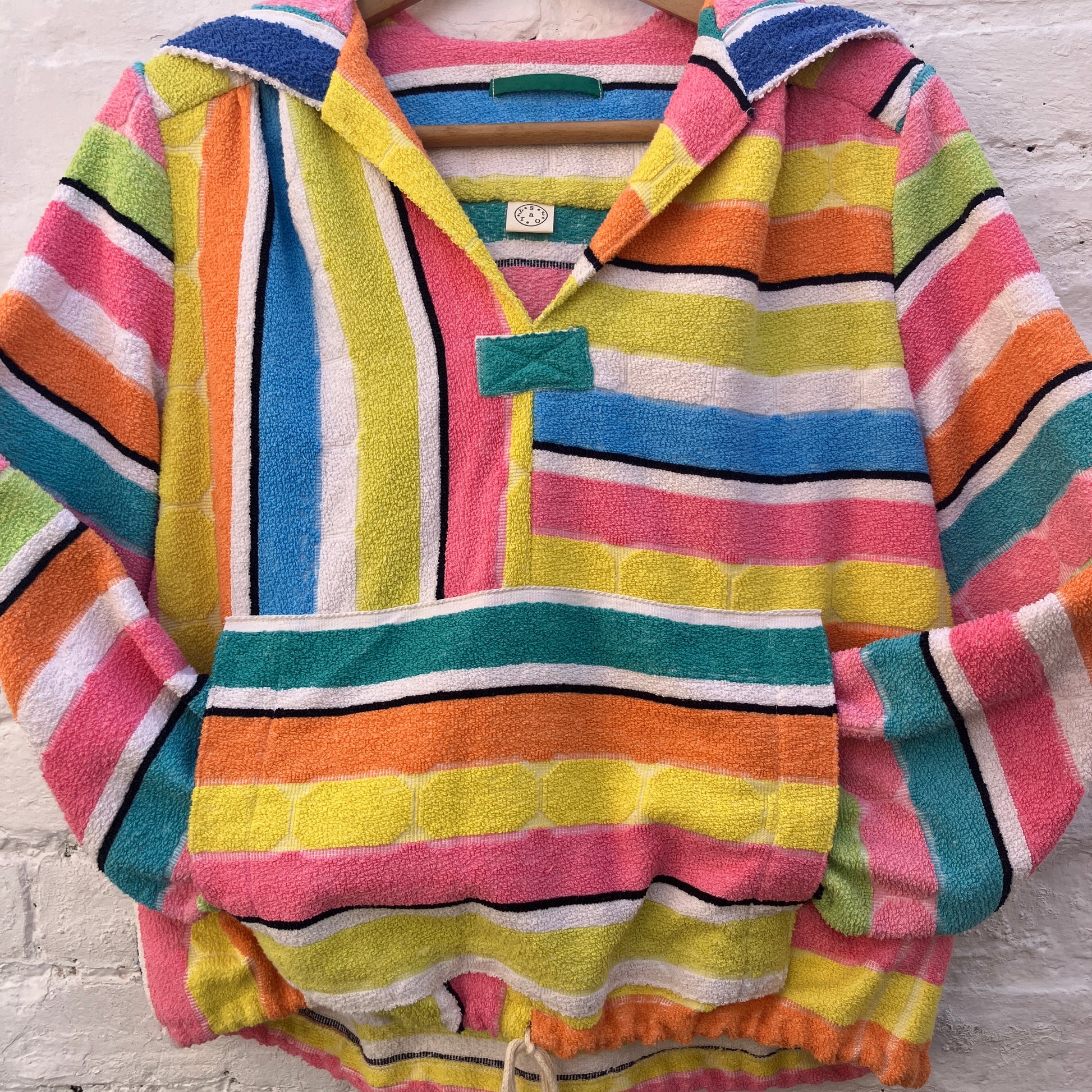 Beach jacket with hood made from two reclaimed 70s stripey towels