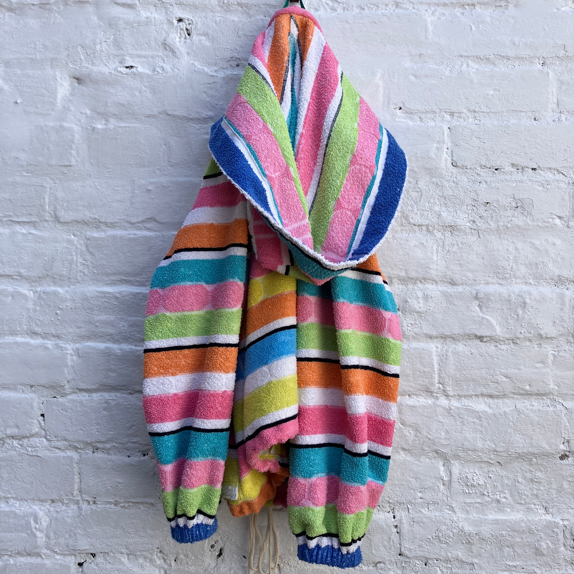 Beach jacket with hood made from two reclaimed 70s stripey towels