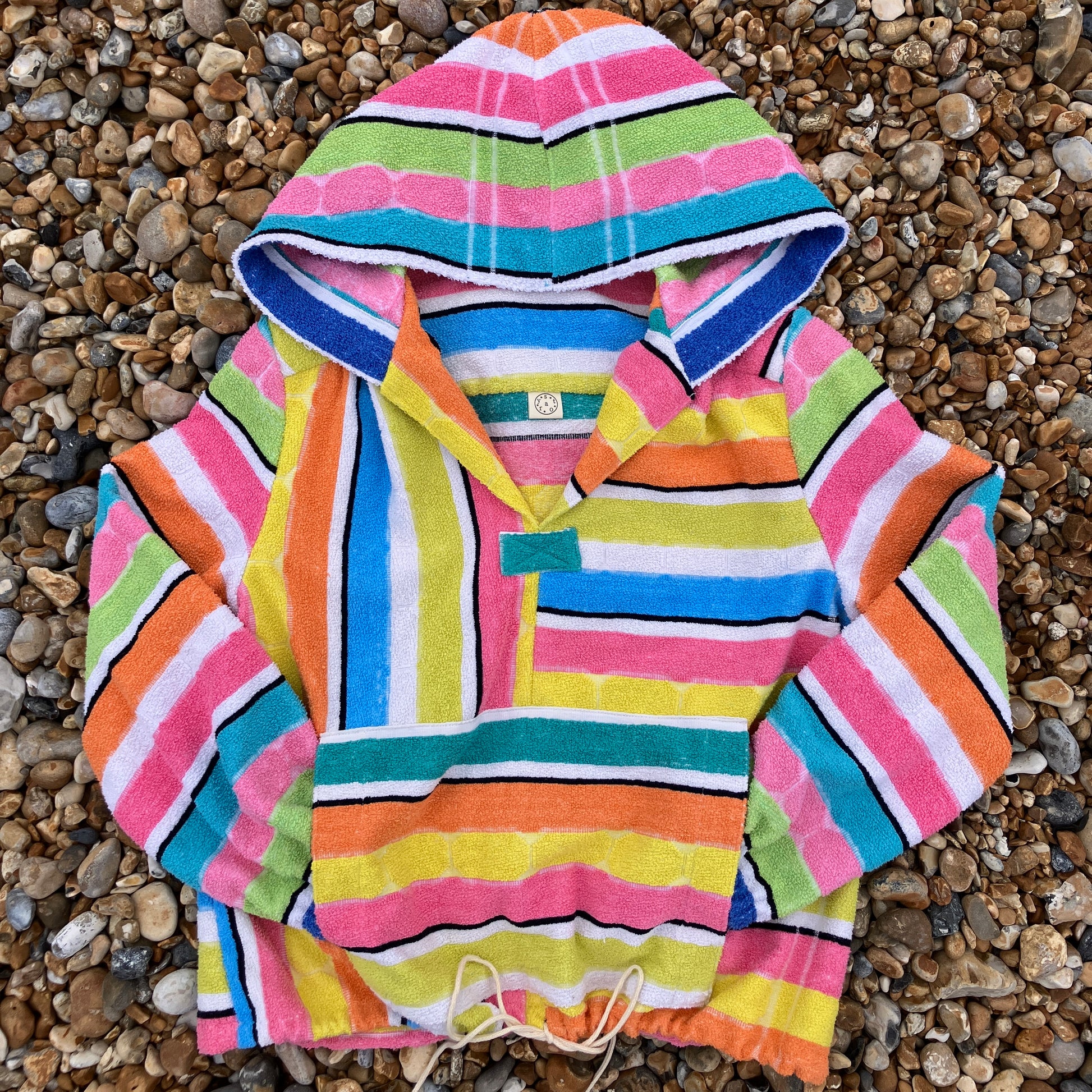 Beach jacket with hood made from two reclaimed 70s stripey towels