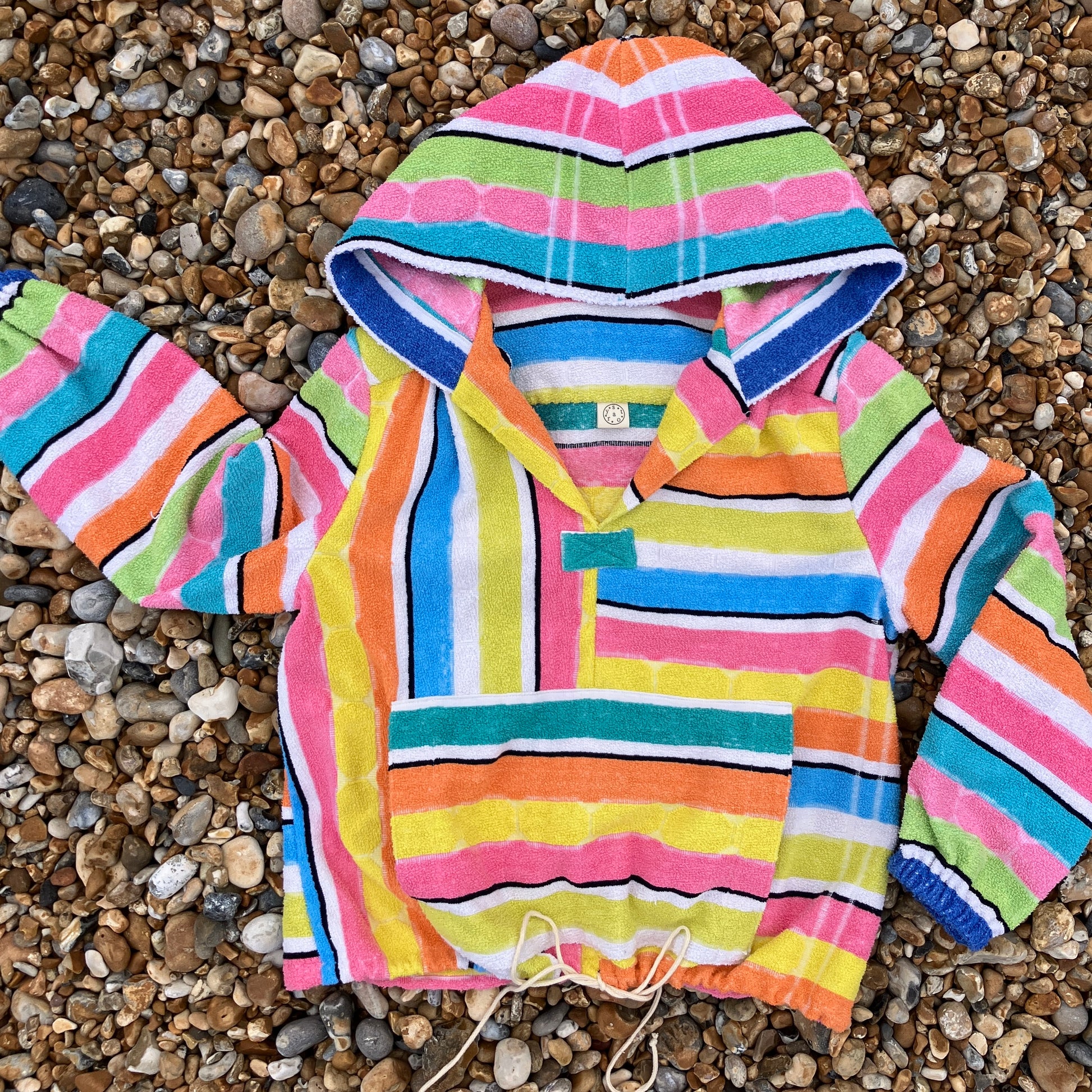 Beach jacket with hood made from two reclaimed 70s stripey towels