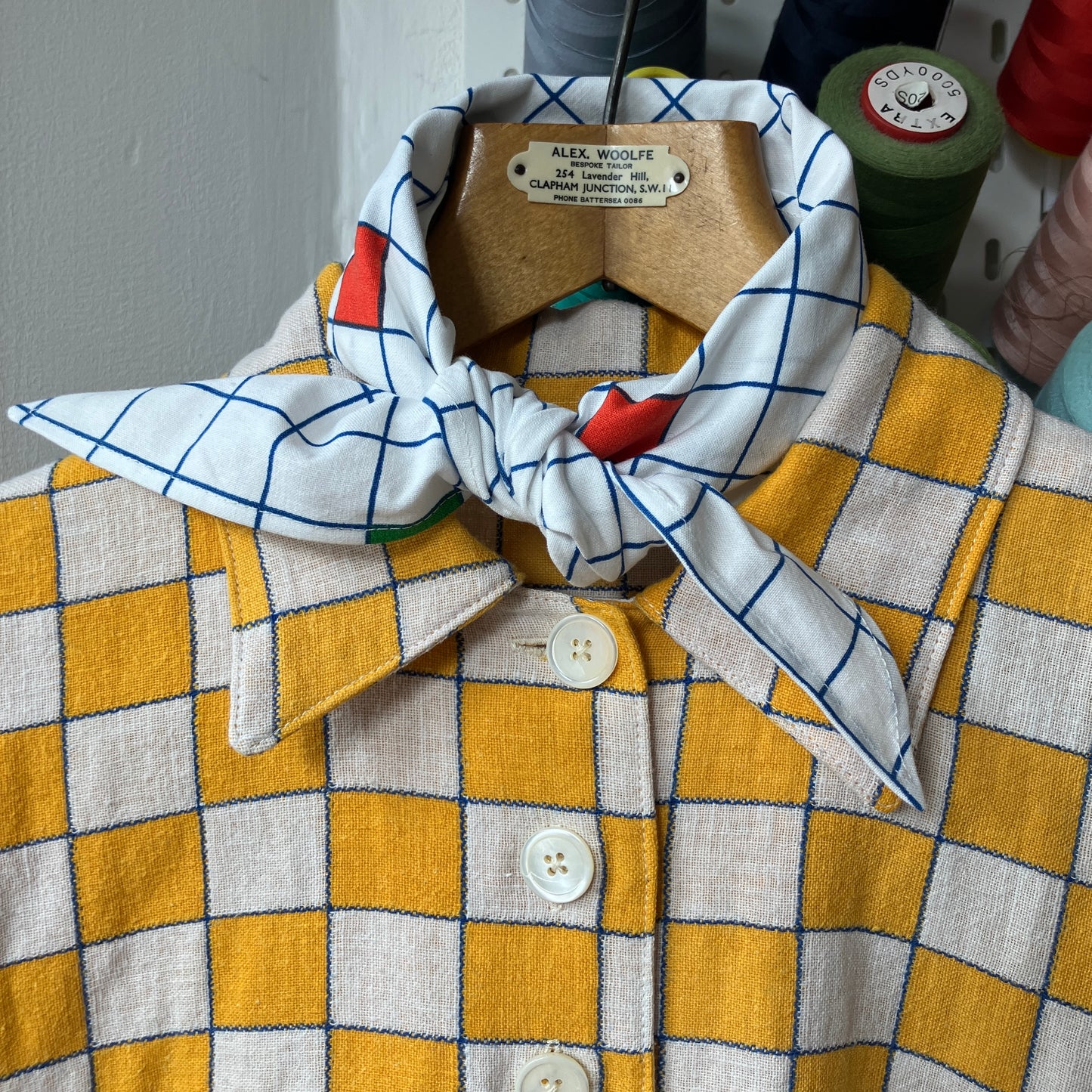 triangular neckerchief in vintage geometric print fabric and yellow and white reclaimed checkerboard linen shirt