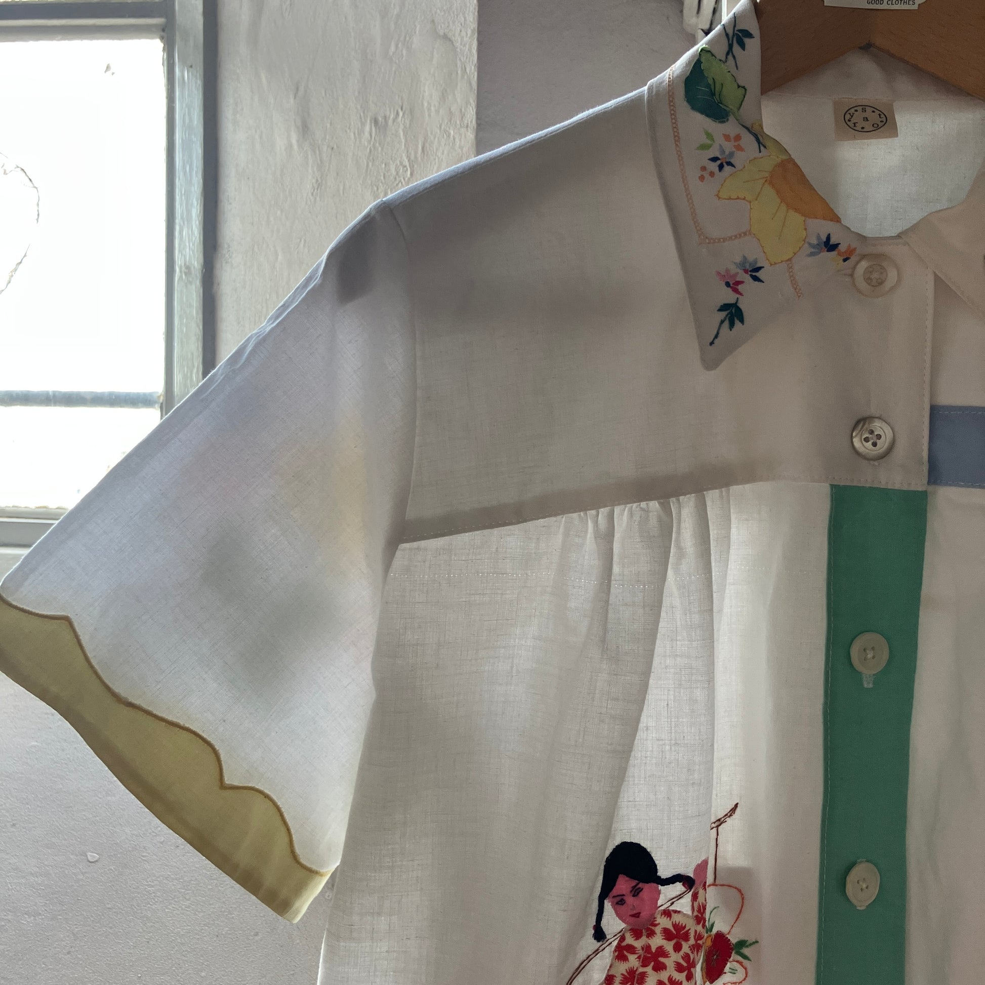 shirt made from reclaimed vintage pillowcases with two appliqué ladies