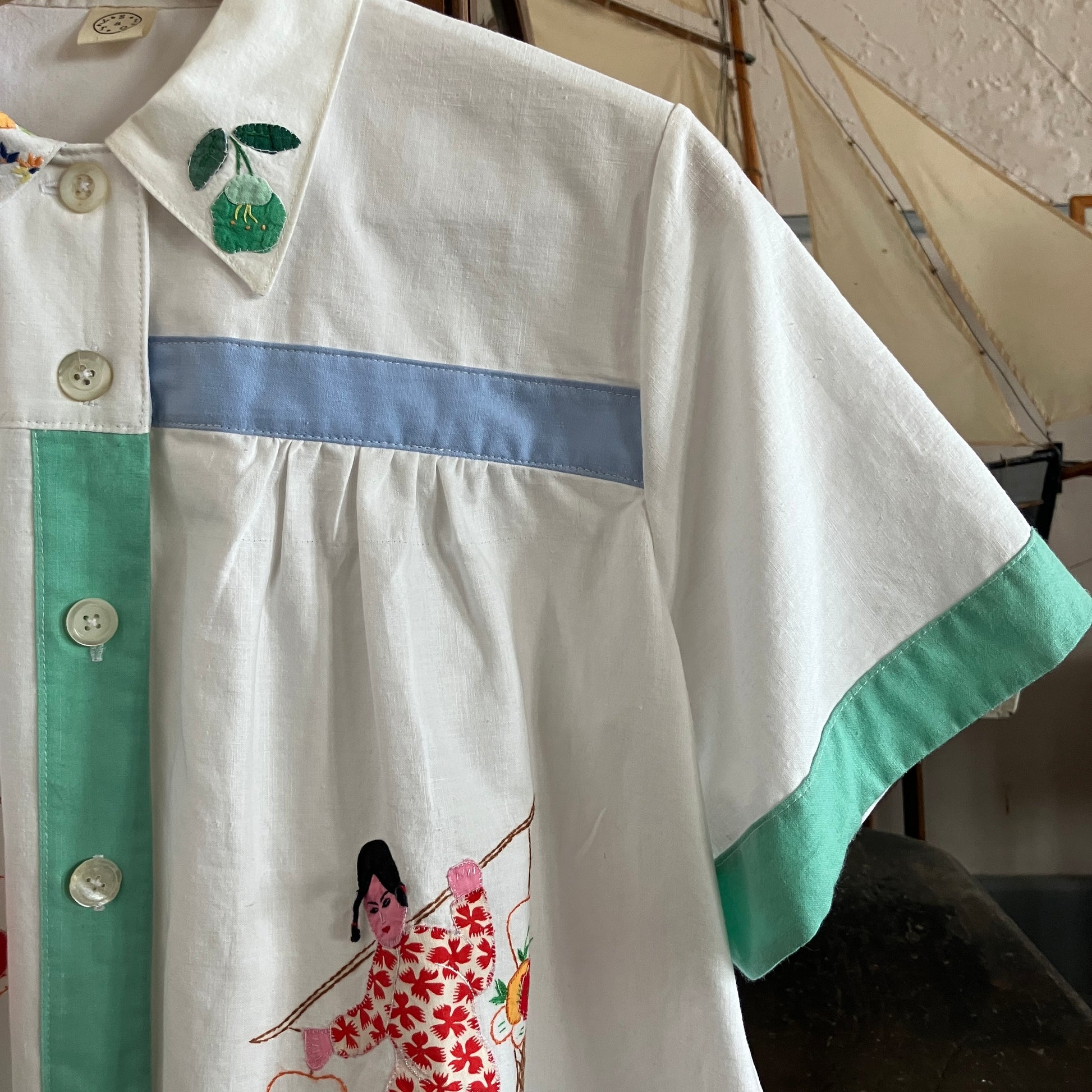 shirt made from reclaimed vintage pillowcases with two appliqué ladies